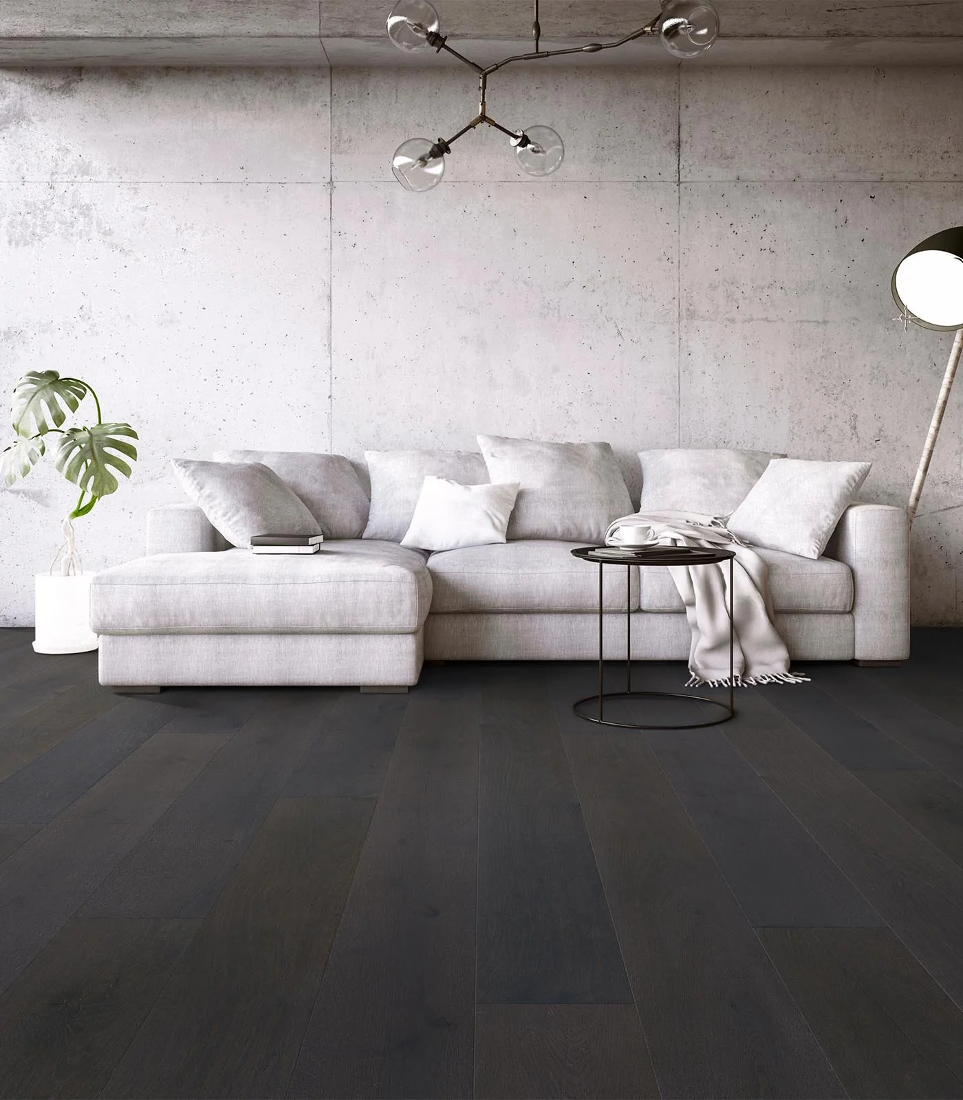 Salón moderno con sillón gris claro, planta en maceta blanca, lámpara de pie y lámpara de techo de diseño minimalista, piso de madera oscura.