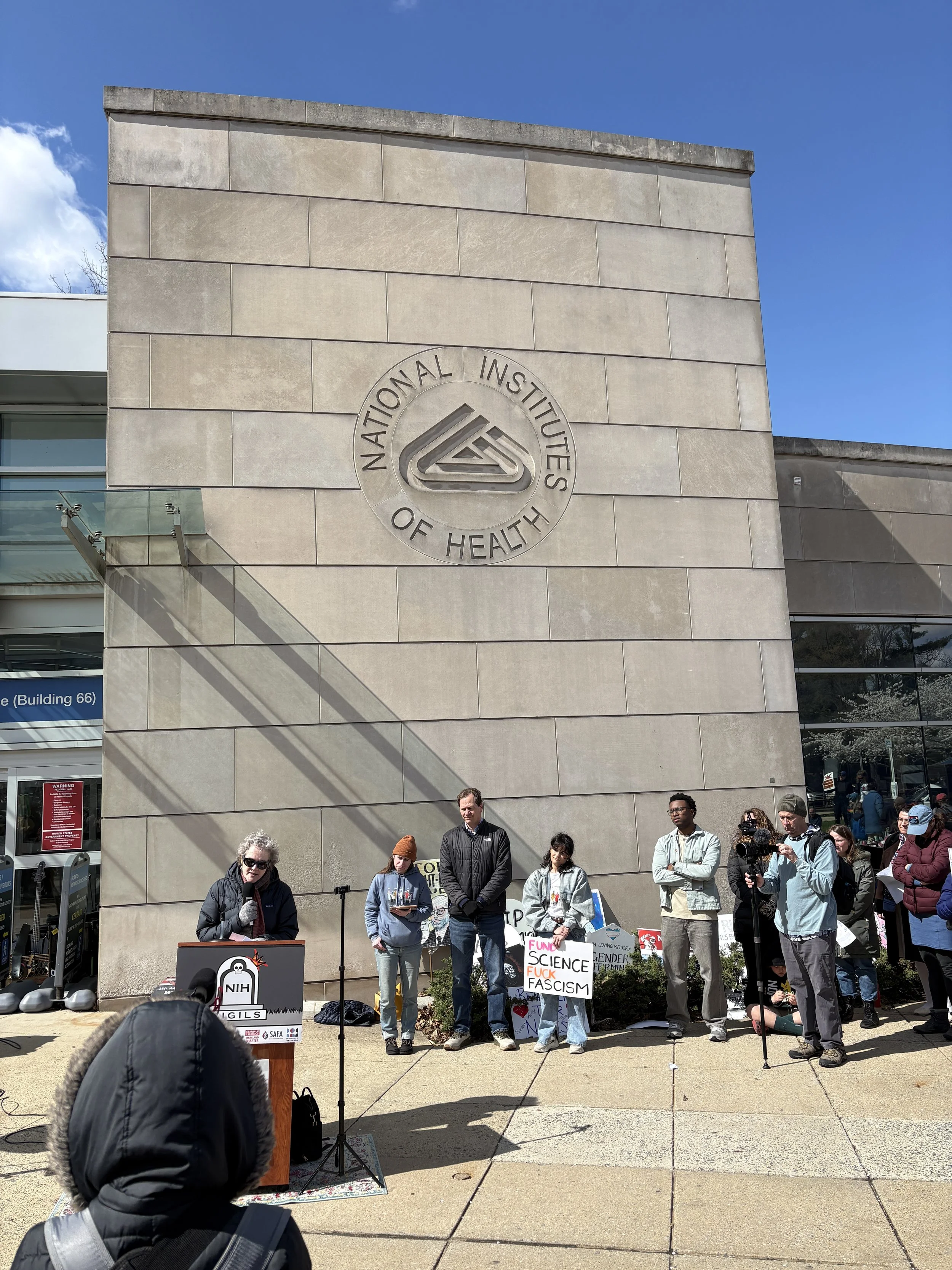 Dr. Jeanne Marrazzo addresses the crowd at the NIH vigil