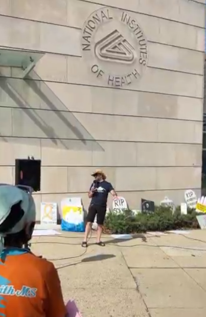A person speaks at the vigil