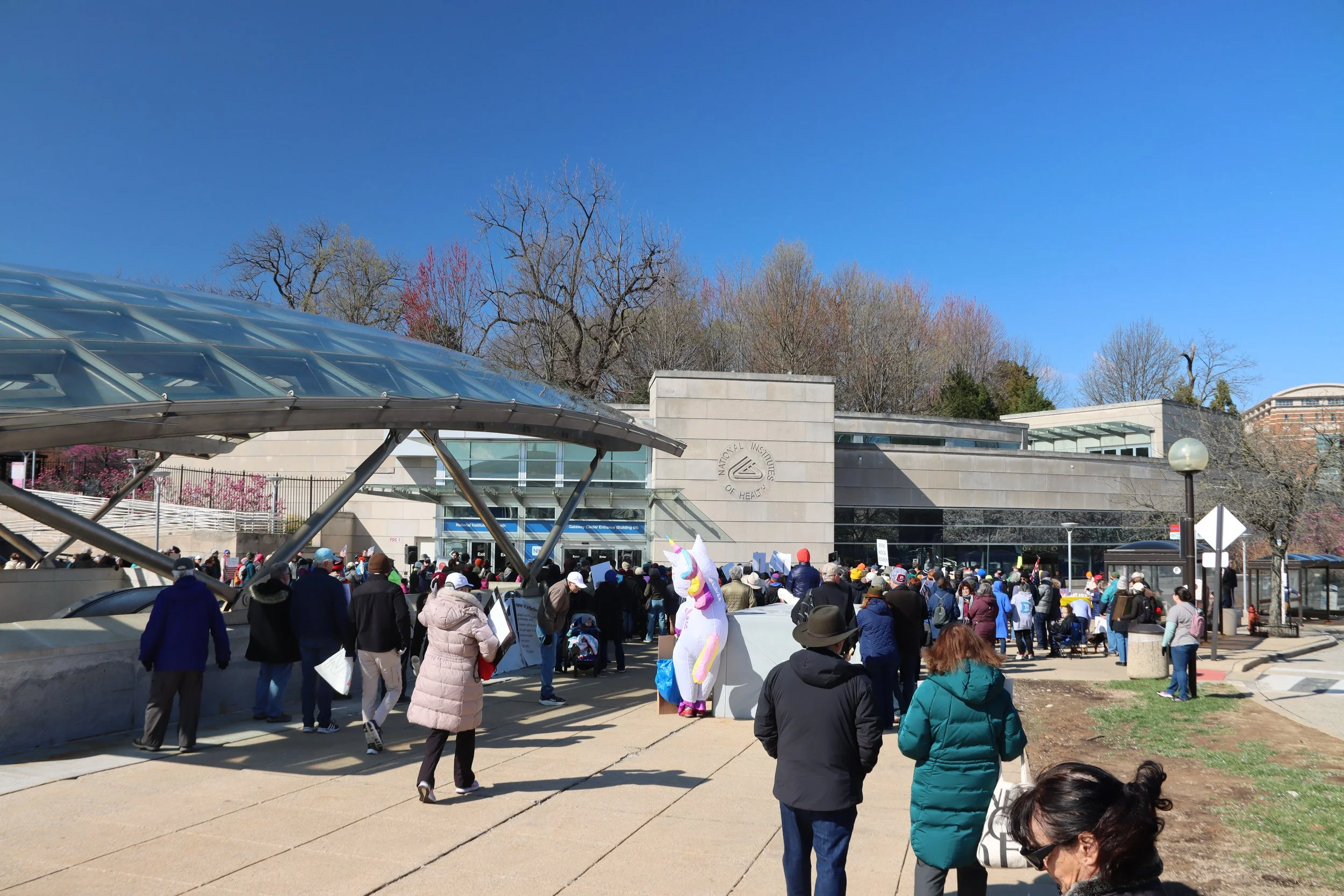 A distant shot of the crowd outside the Medical Center Metro exit