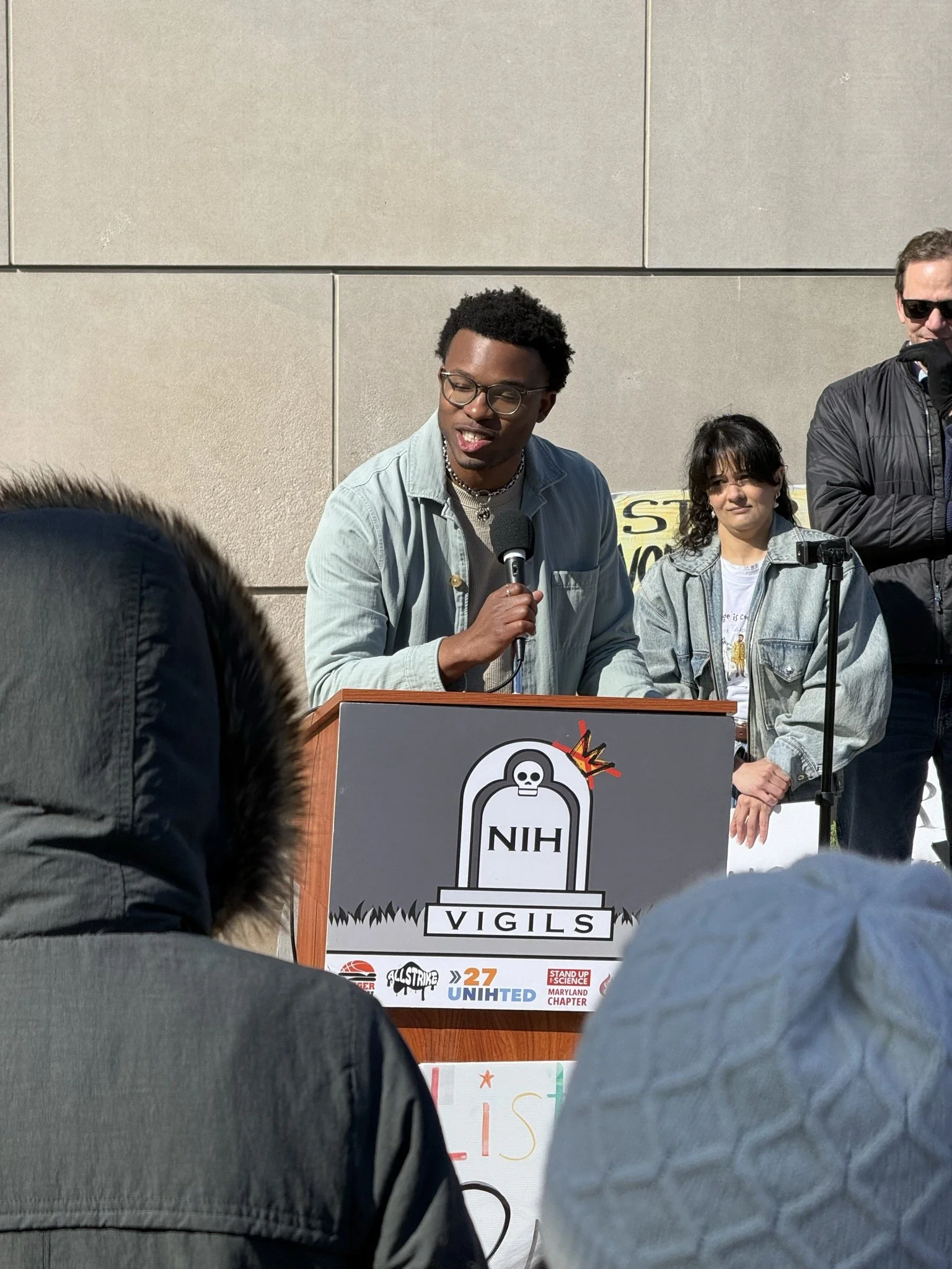 A man speaks at the vigil