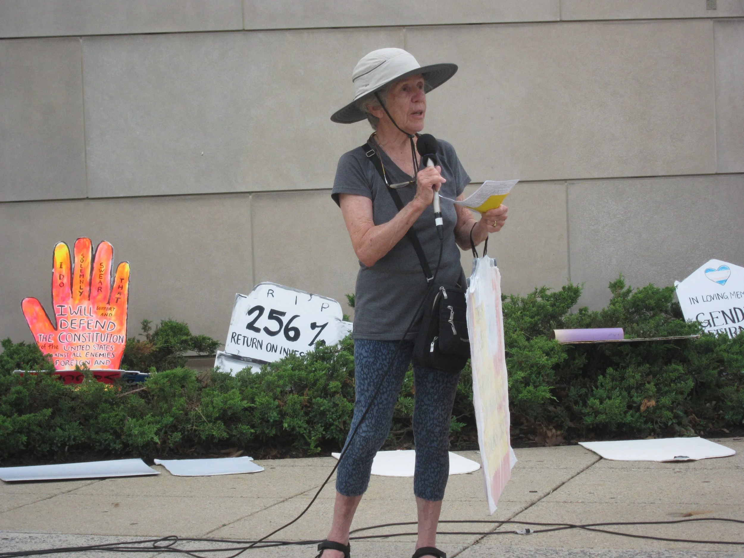 A woman speaks into a microphone