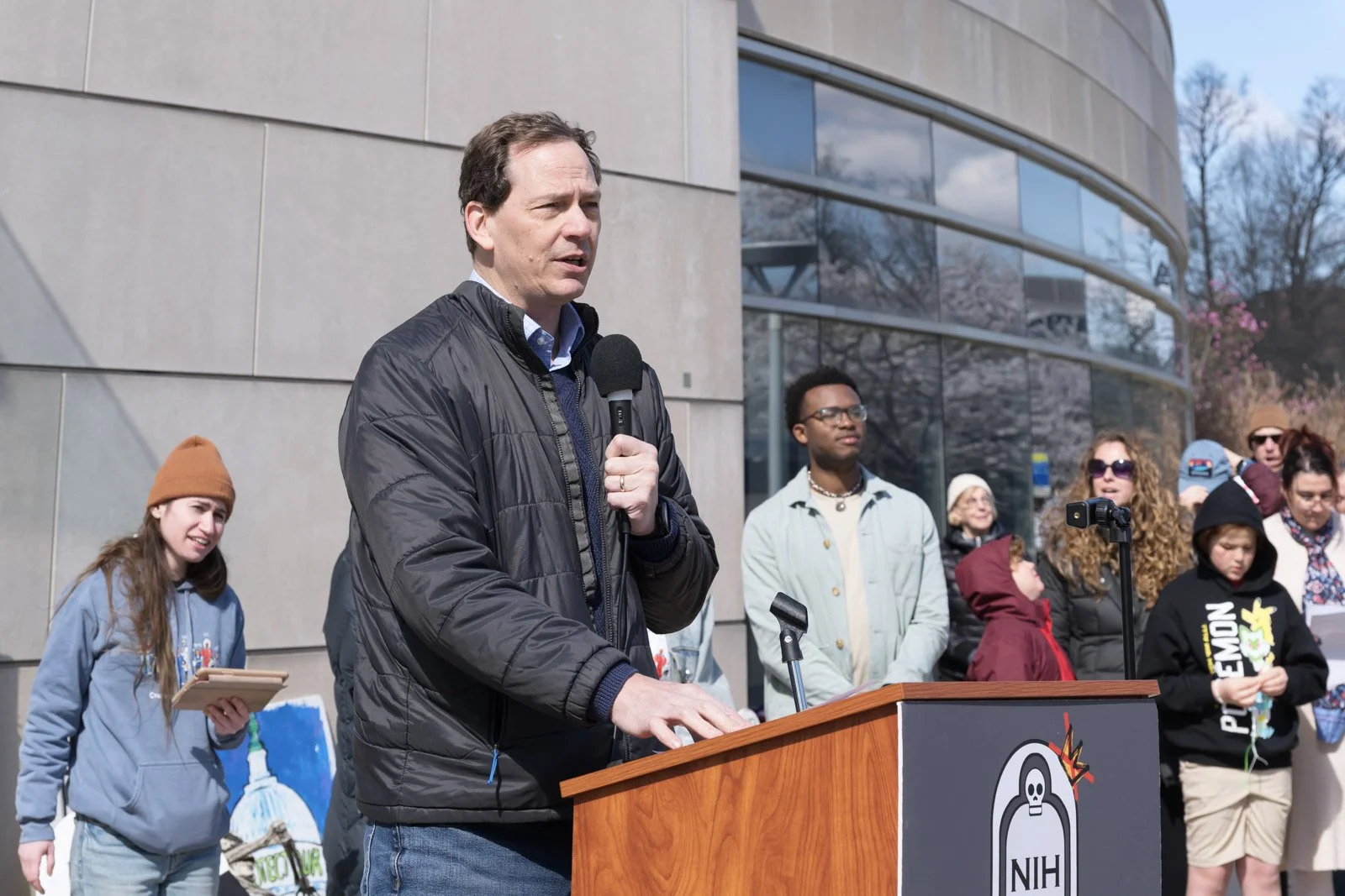 A man speaks at the lectern