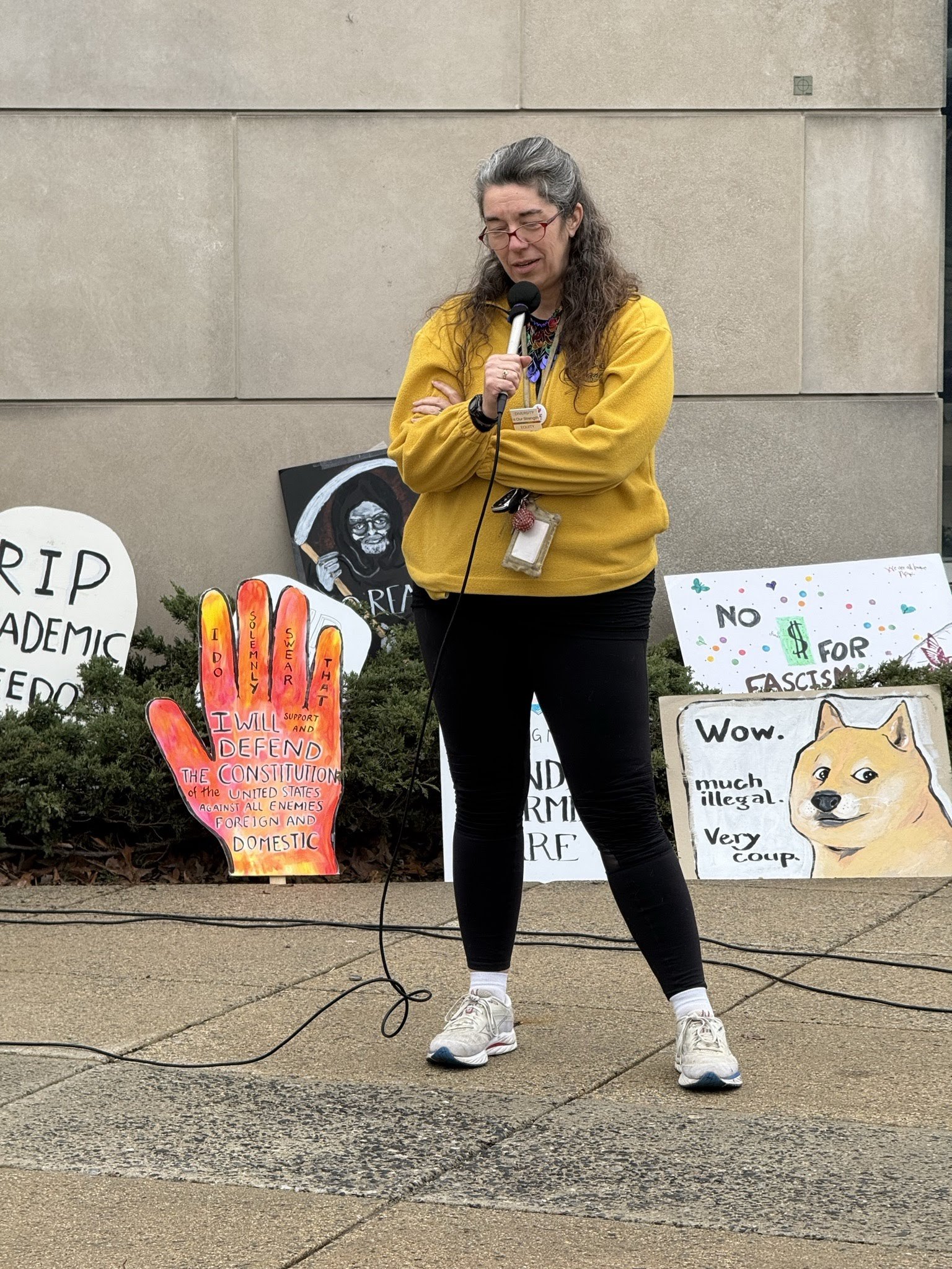 A woman speaking at the vigil