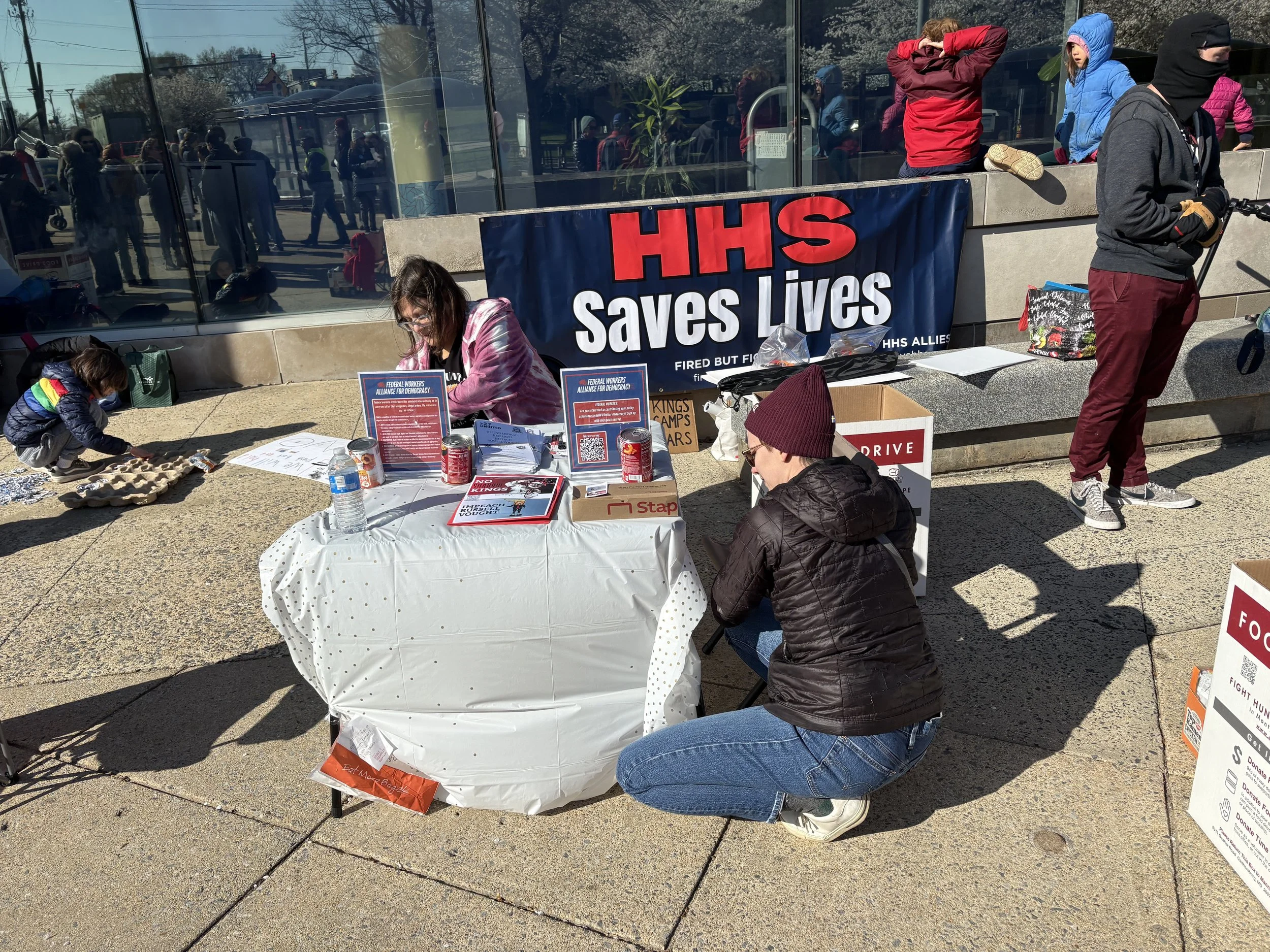 An information table with a banner that says "HHS Saves Lives"