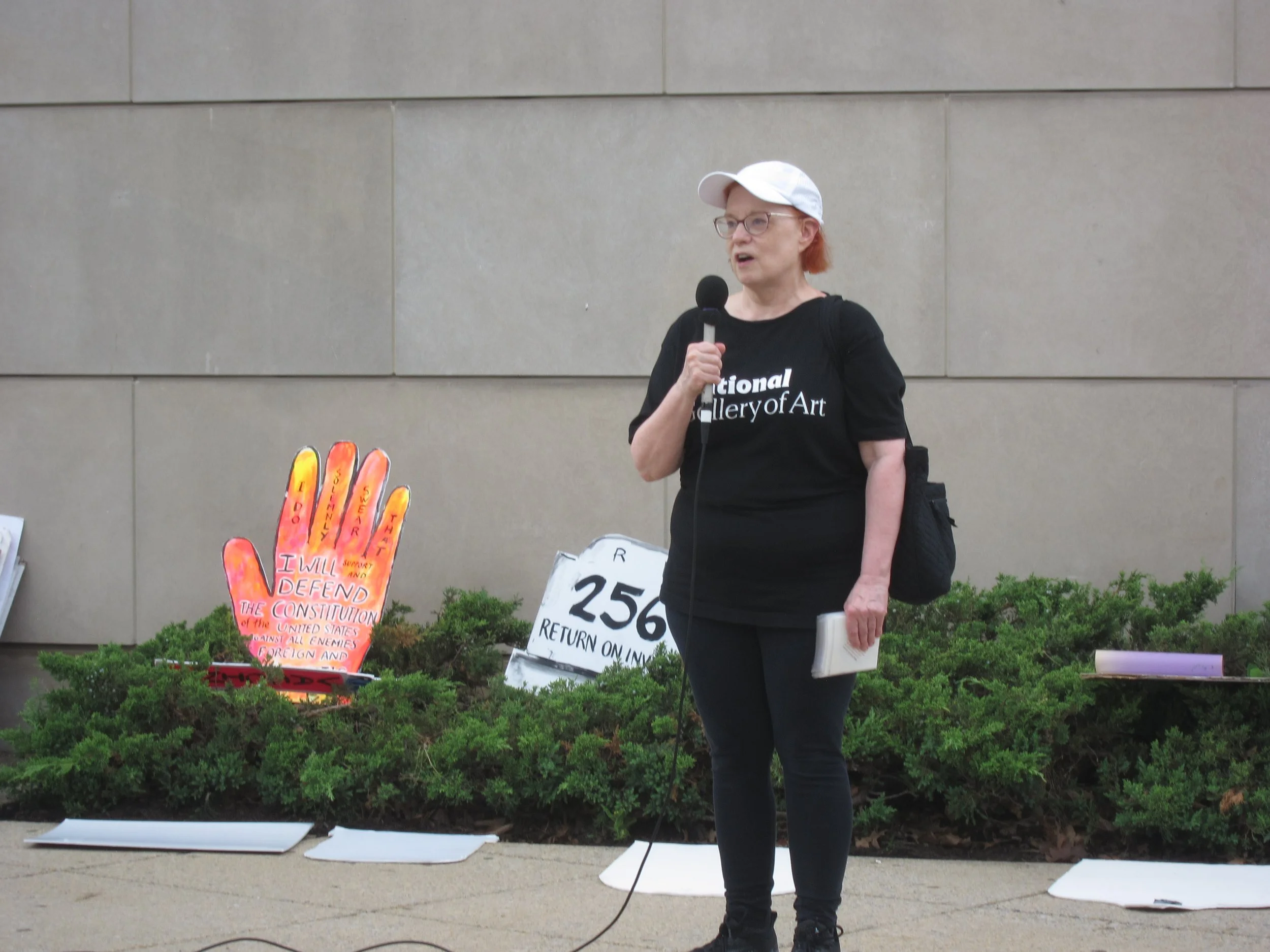 A person speaks into a microphone