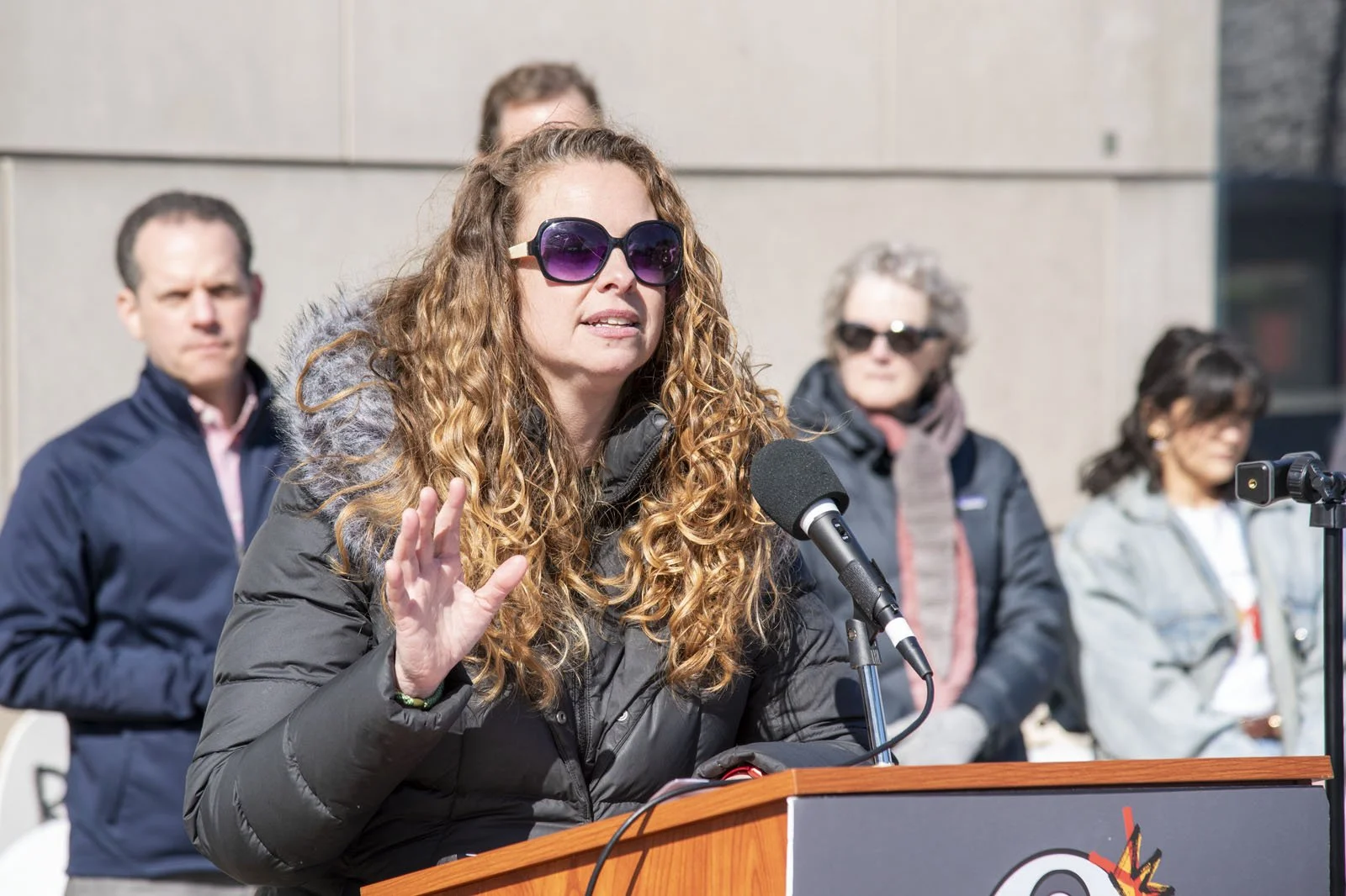A woman speaks at the vigil/rally