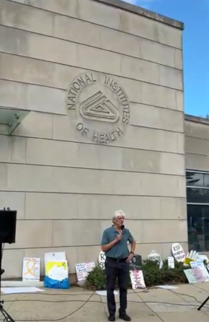 A man speaks at the vigil