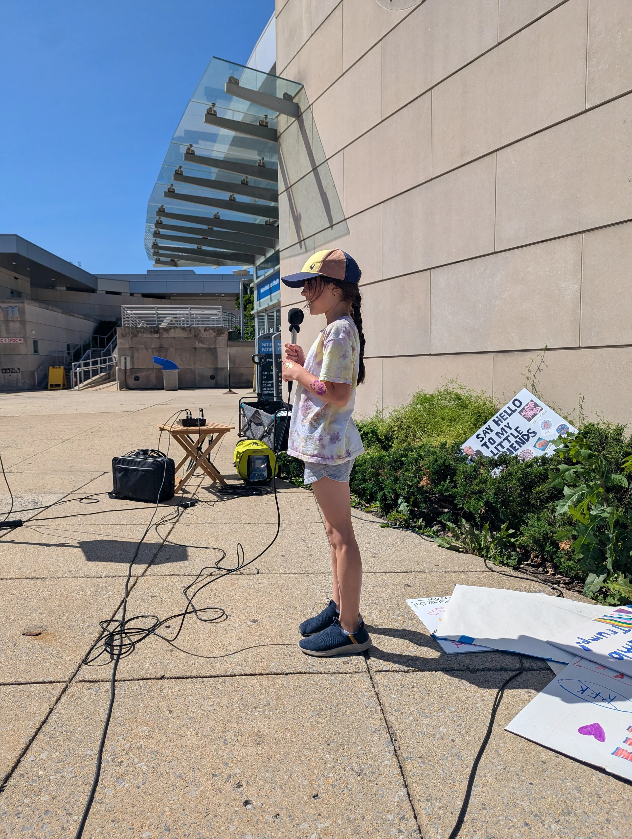 A young girl speaks at the vigil