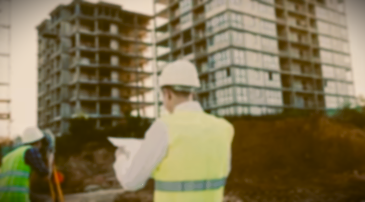 A logo featuring a house and a crane with the word "TURNKEY" beneath it.