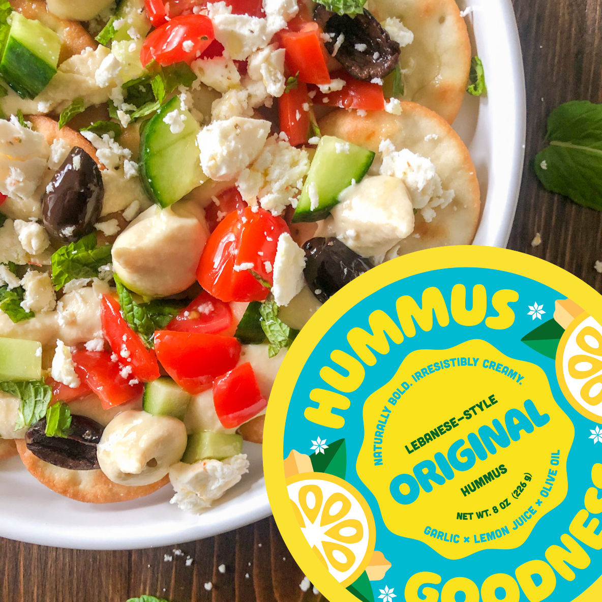 Easy Game Night Appetizer of Hummus Nachos with pita chips, original hummus, fresh chopped veggies and feta cheese