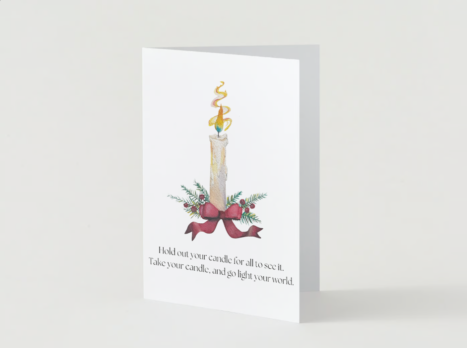 A greeting card featuring a lit candle decorated with holiday greenery and a red ribbon, with a message encouraging lighting the candle to bring light to the world.