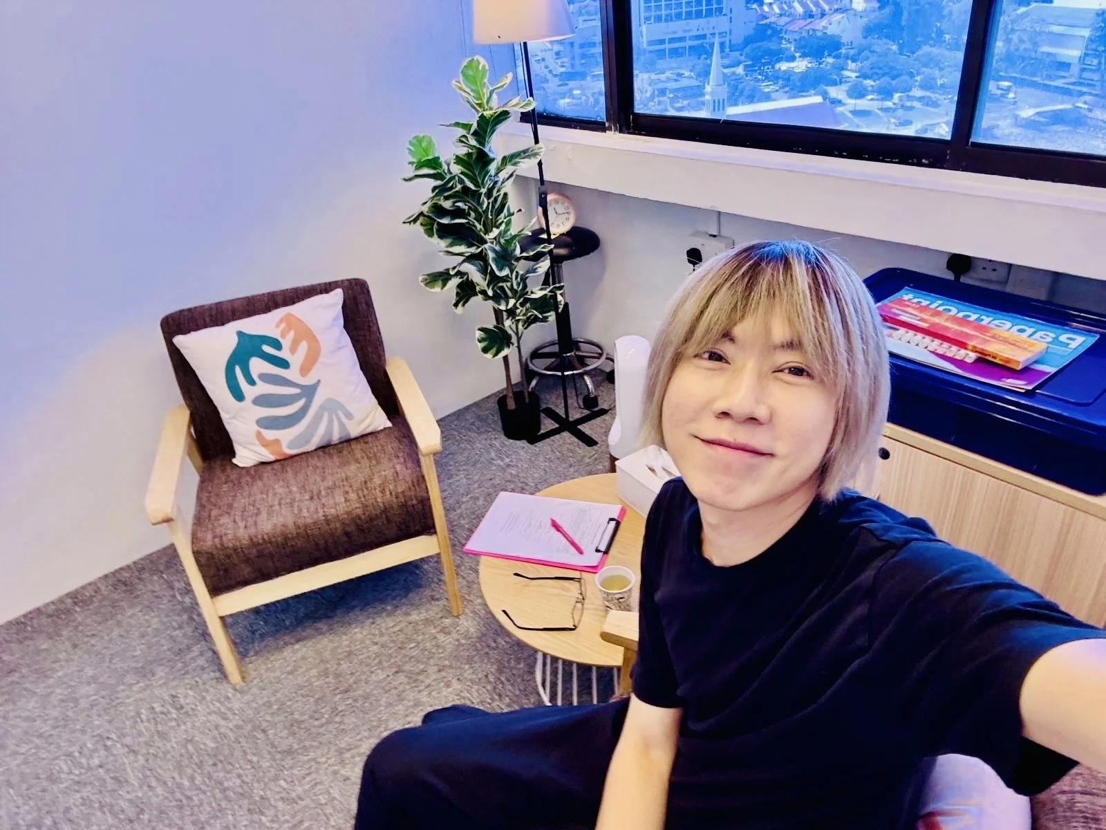 Allan Ng counsellor in Singapore sitting in his therapy room creating a safe and welcoming space