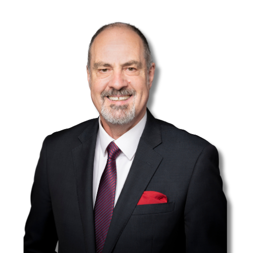 Peter Nola, business broker and author in a black suit, white shirt, and red tie, with a red pocket square, against a black background.
