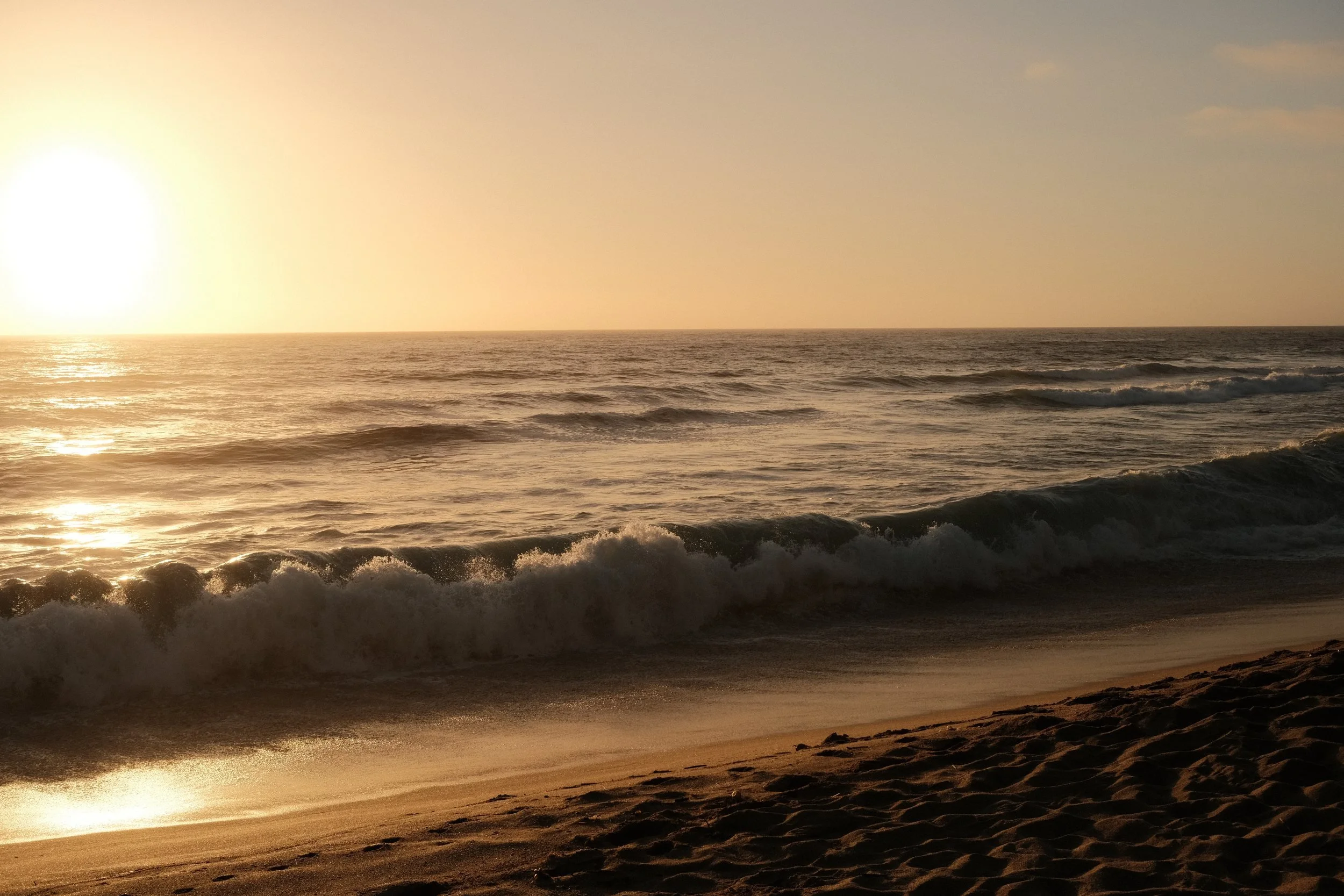 Ocean waves at sunset