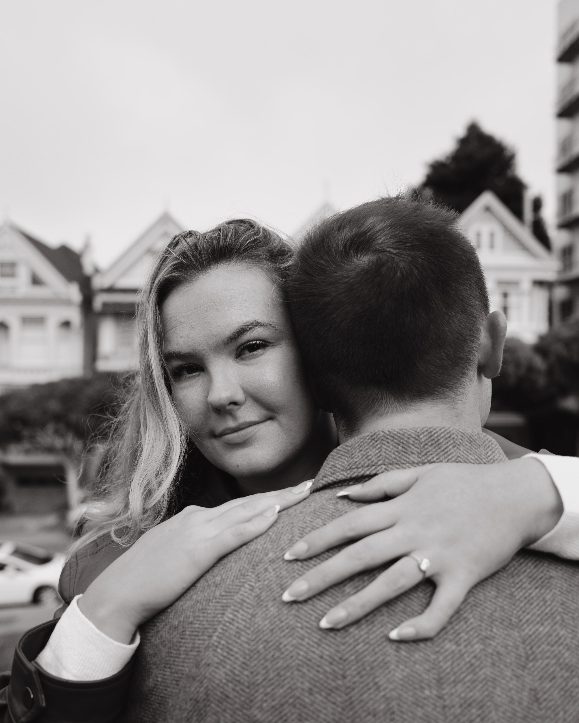 Black and white close-up of a couple embracing outdoors