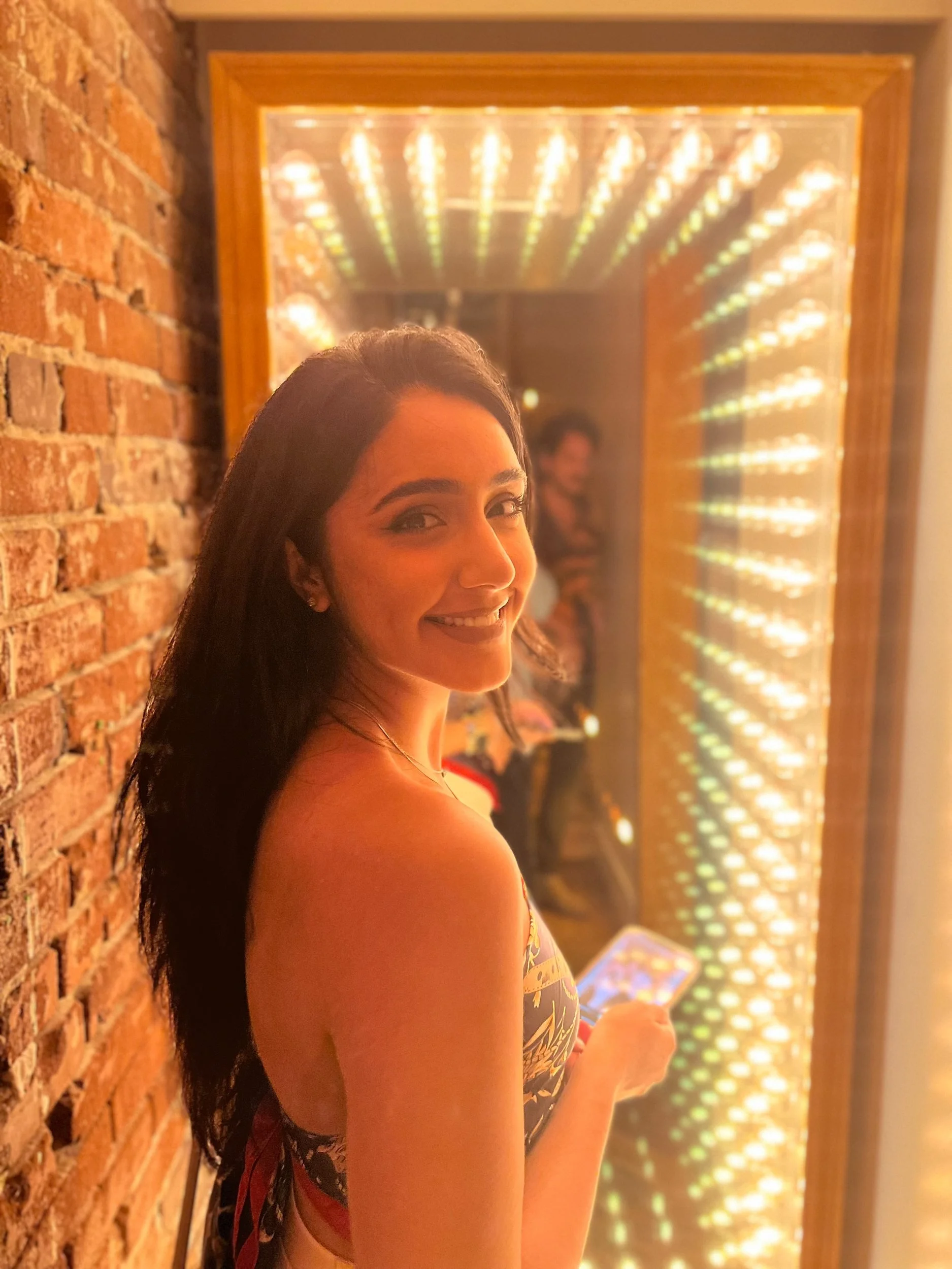 Portrait beside a brightly illuminated mirror