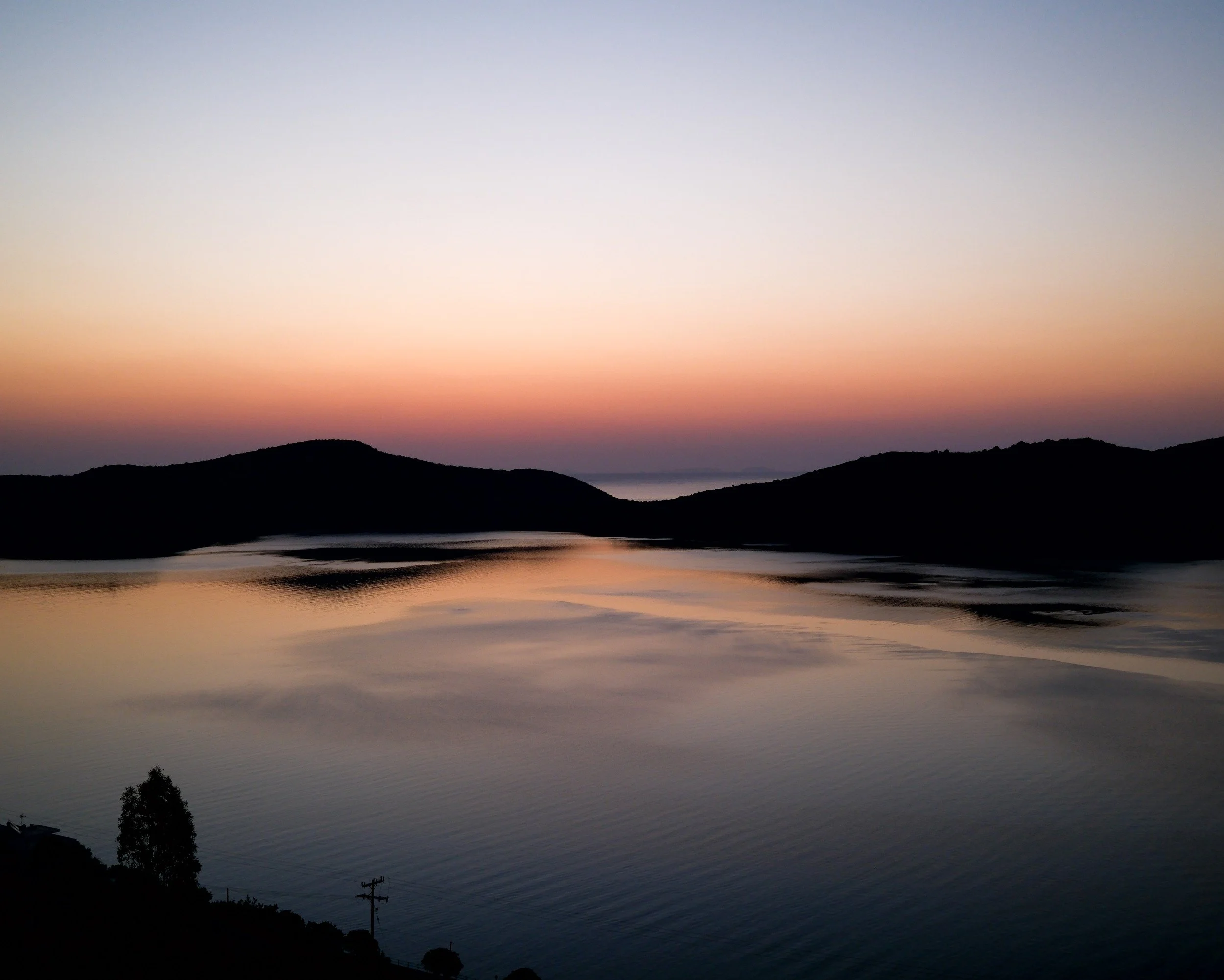 Fog over dark hills at twilight