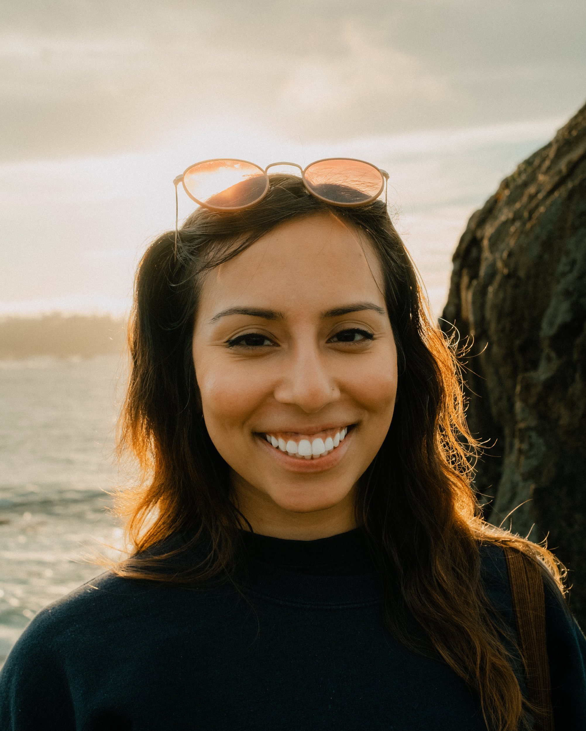 Smiling outdoor portrait in warm coastal light