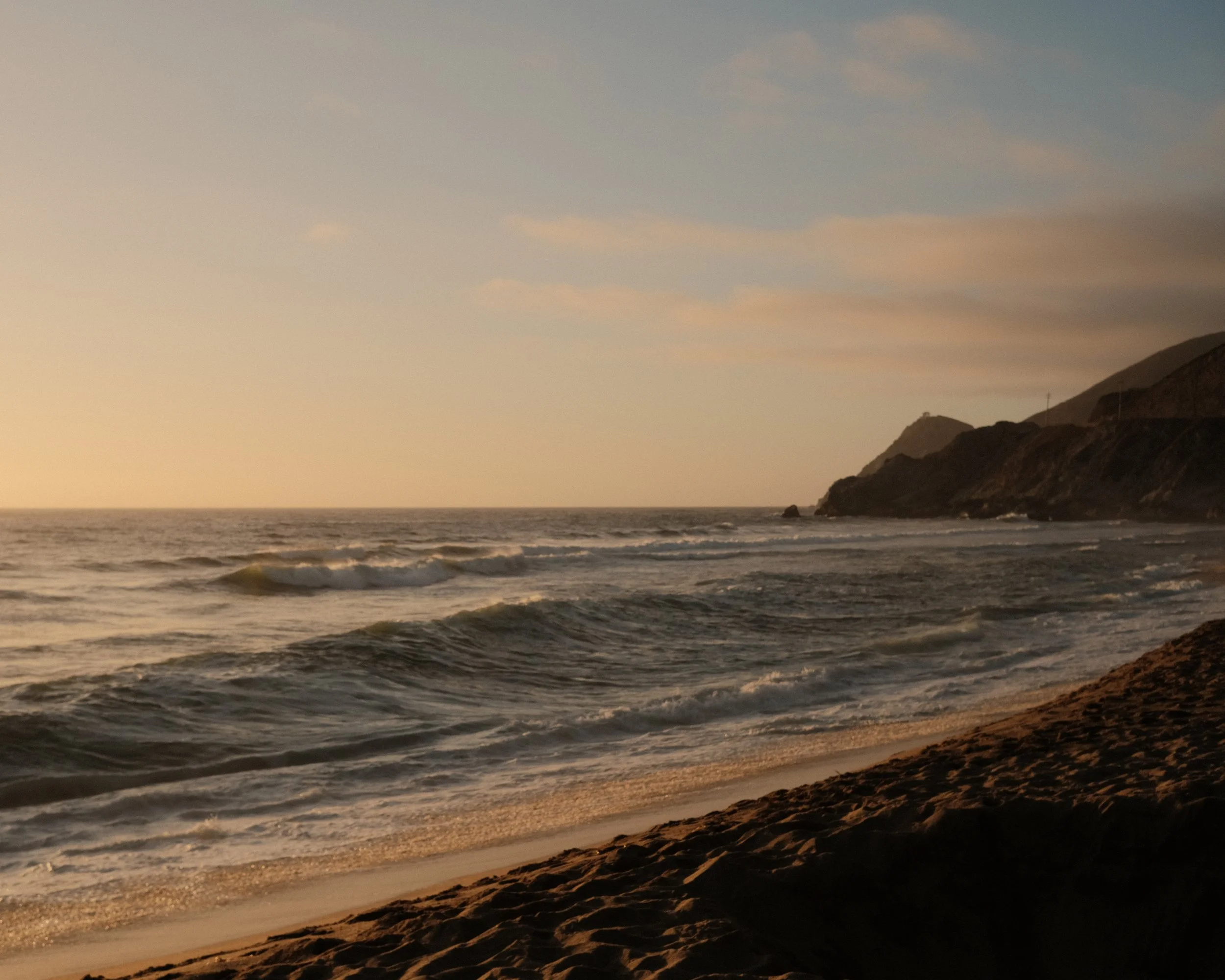 Golden evening light along a rocky coastline