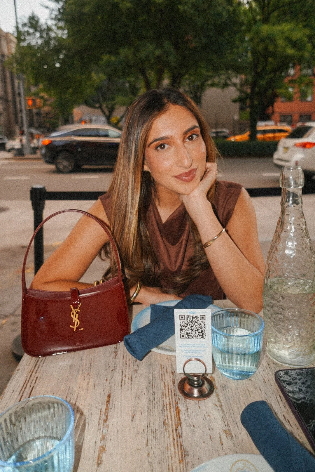Seated portrait at an outdoor city table