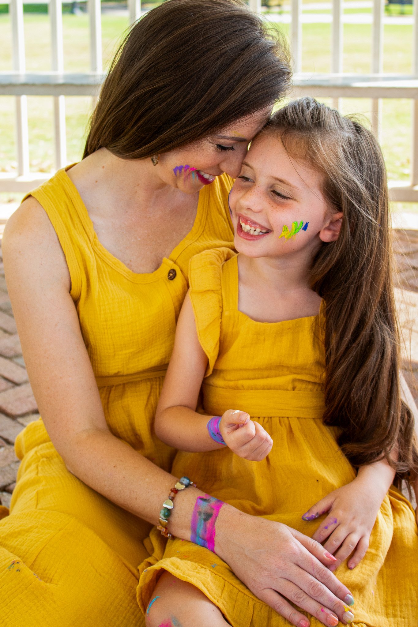 mother and daughter, paint session, outdoors