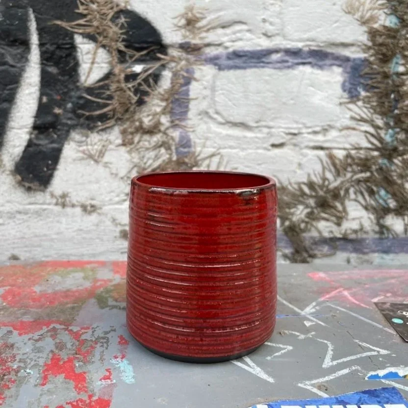 hand-glazed ceramic coffee mug in glossy red, punk minimal aesthetic, Auburn Alabama
