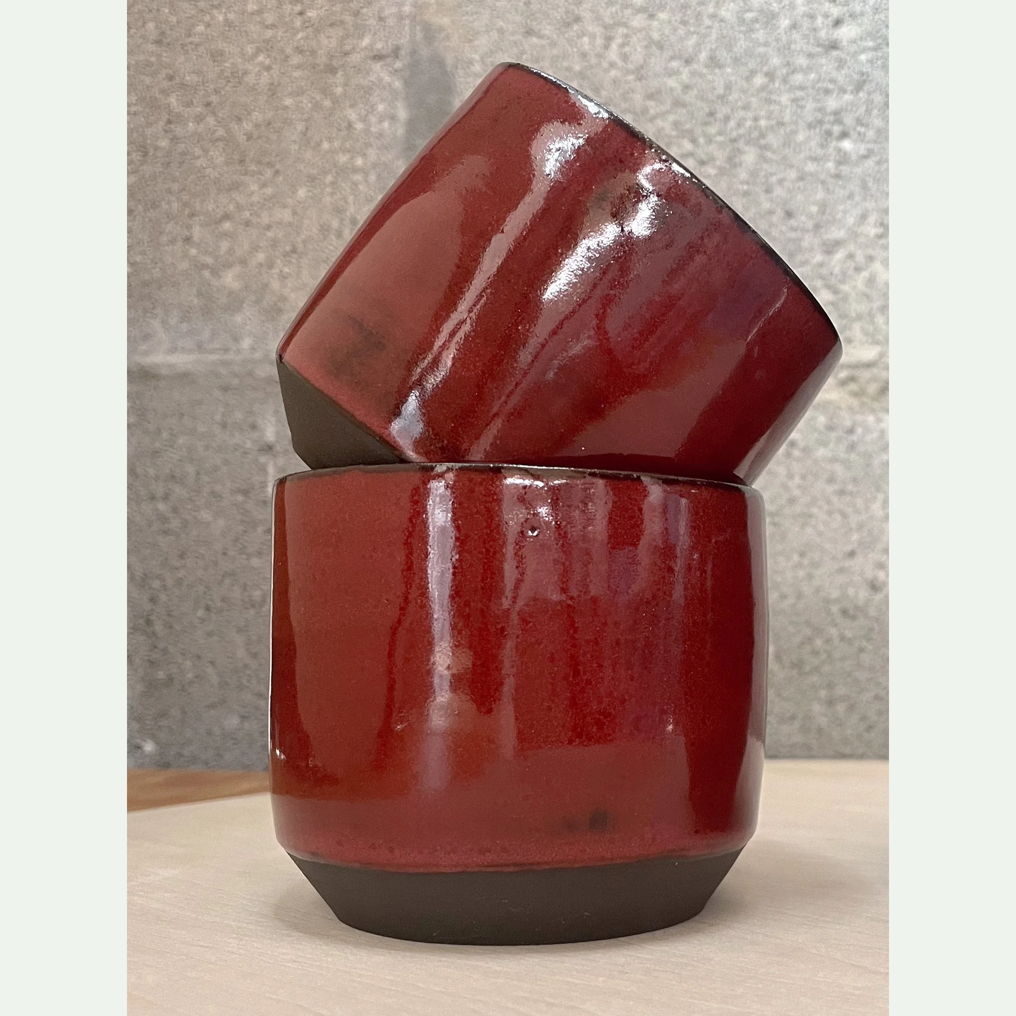 hand-glazed ceramic pottery cup in glossy red and black, brutalist minimal edge, Auburn Alabama