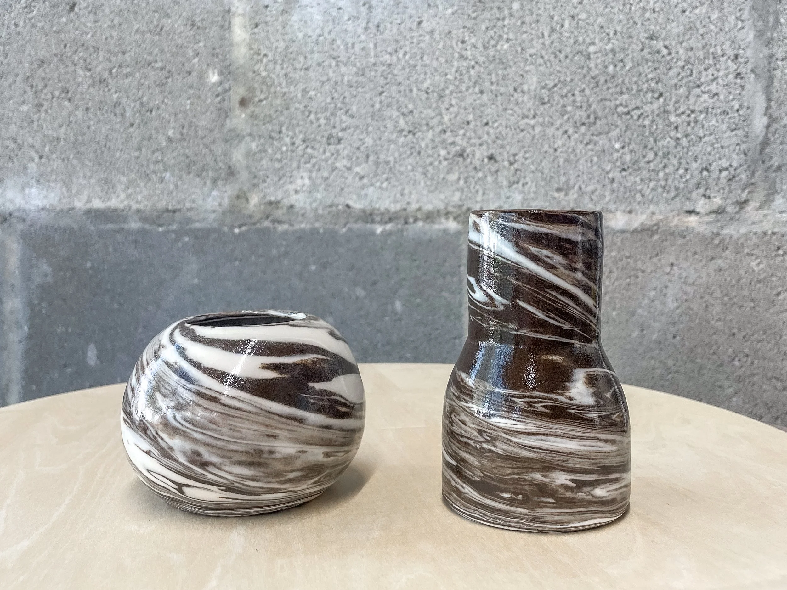 wheel-thrown stoneware vase in marbled dark and light clay, brutalist Nordic form
