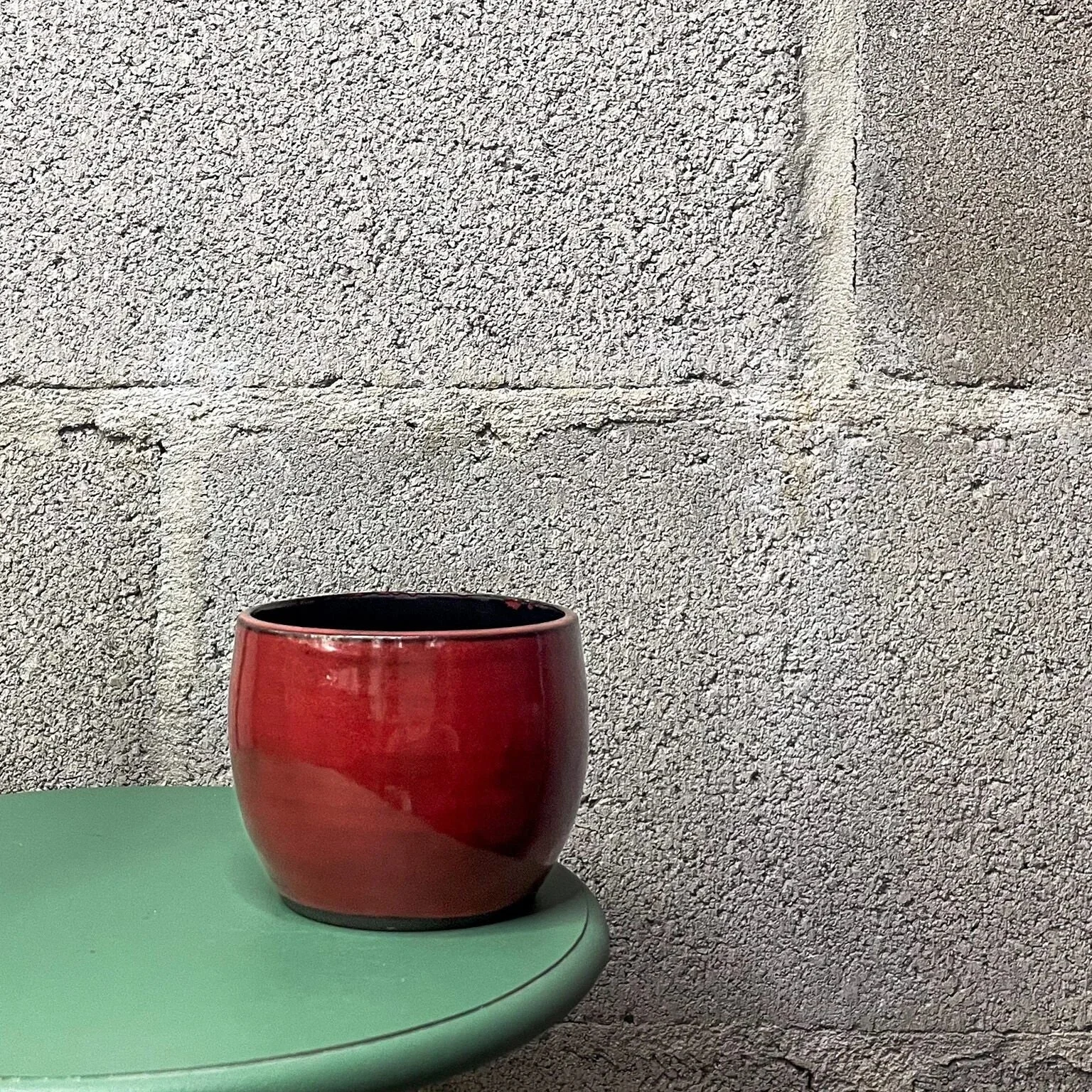 hand-glazed ceramic mug in glossy red and black, punk minimal aesthetic, Auburn Alabama