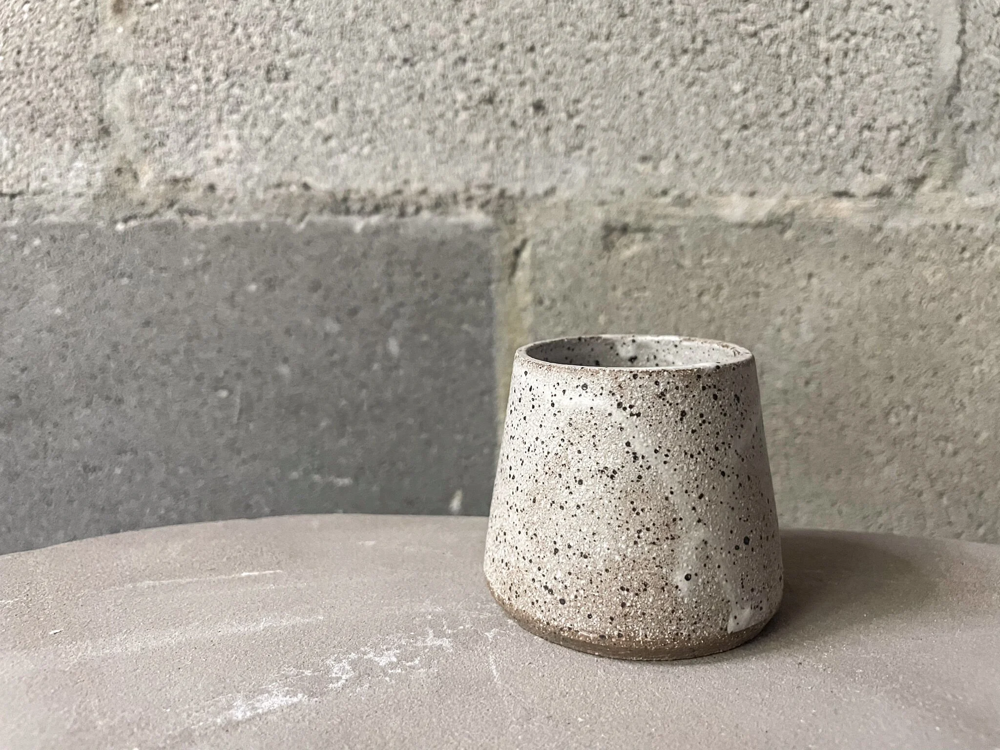 wheel-thrown stoneware espresso cup in speckled white glaze, brutalist design, Auburn Alabama
