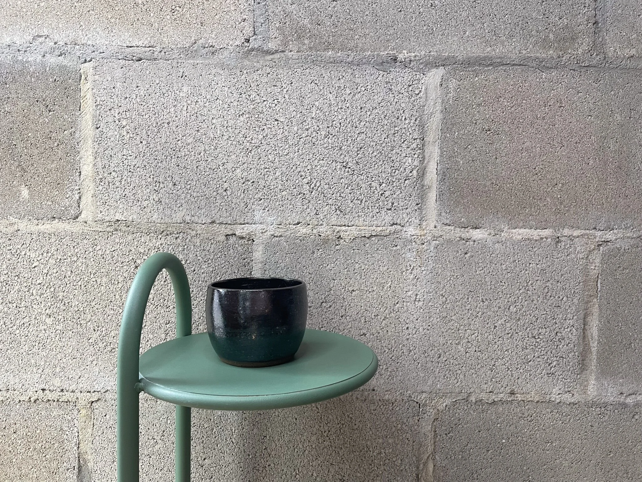 wheel-thrown stoneware espresso cup in metallic gray glaze, stark Scandinavian design