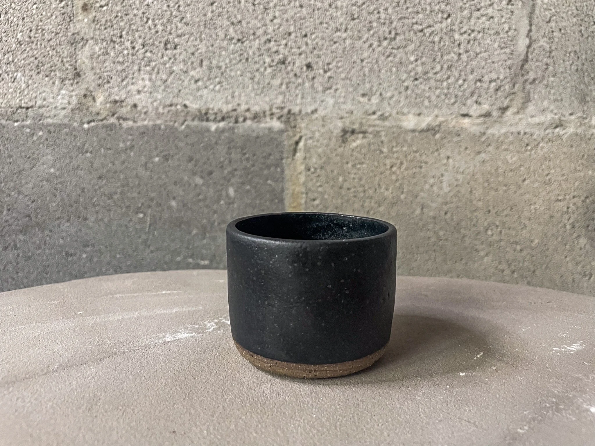 wheel-thrown stoneware espresso cup in matte black, punk handmade design, Auburn Alabama