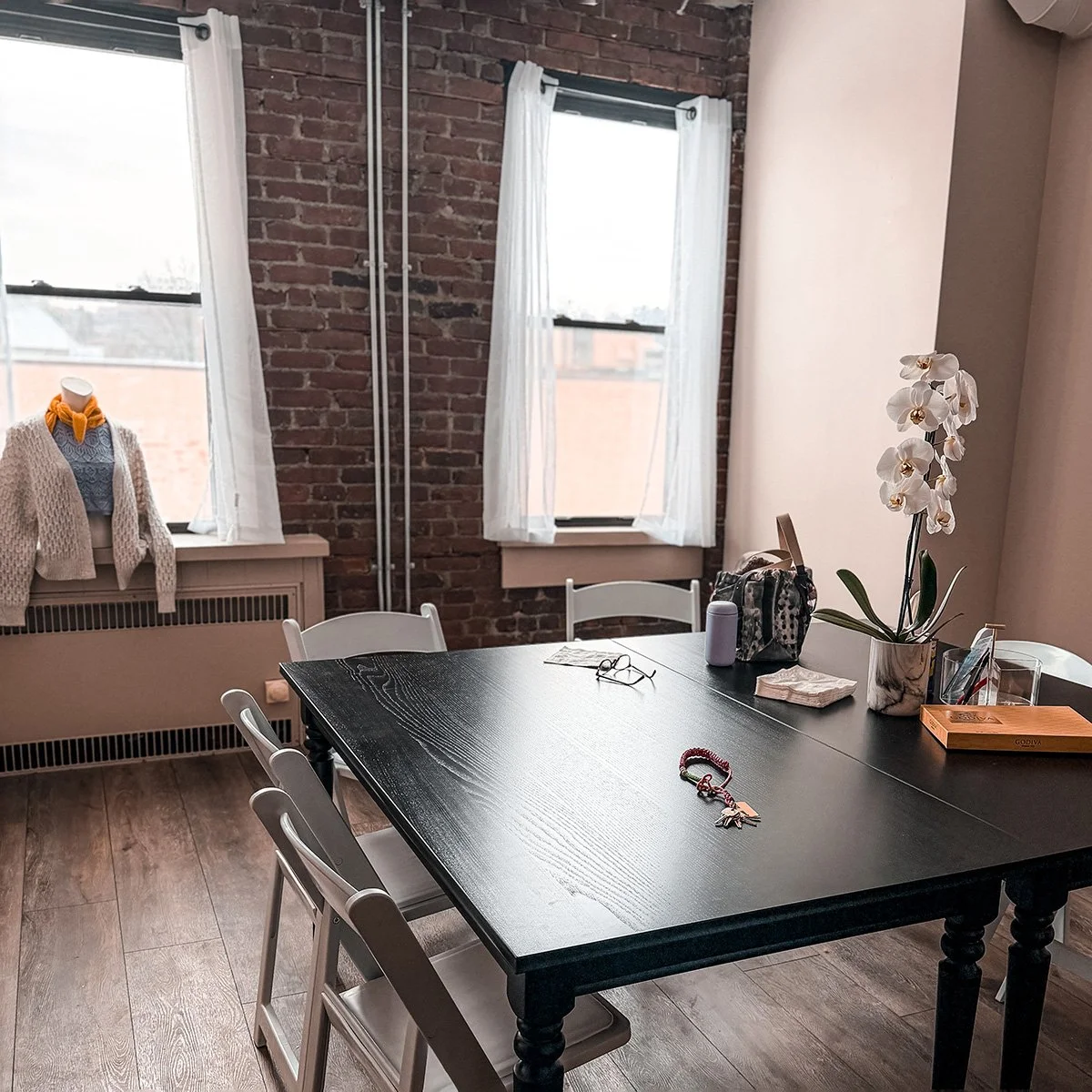 The All The Strings Studio at 64 Wall Street, Suite 305 in Norwalk, CT. The space contains big tables and plenty of chairs for classes, workshops, private lessons and community meetups.