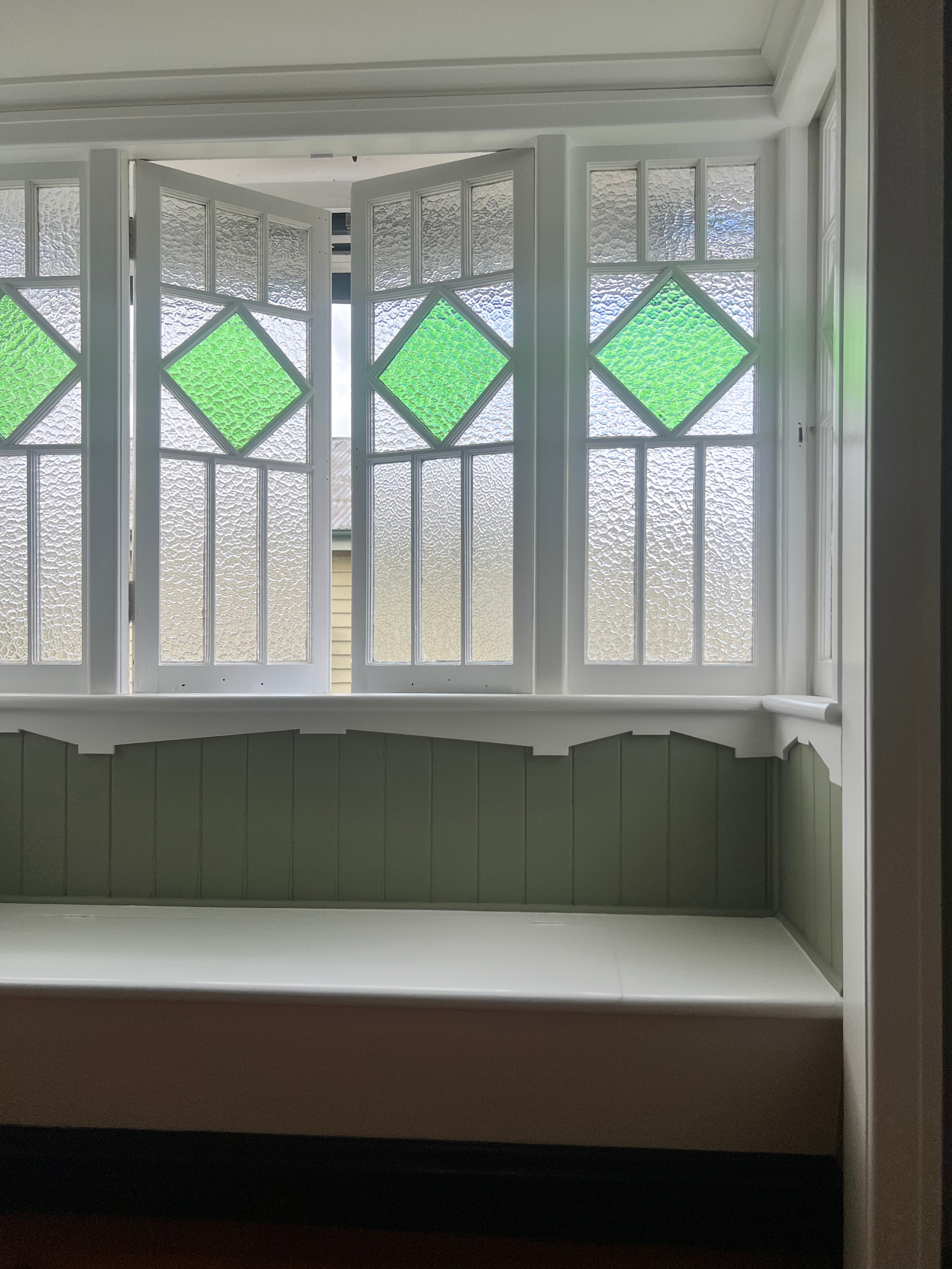 The stained-glass bay window area has been repainted using products from Dulux and Porter’s Paints.