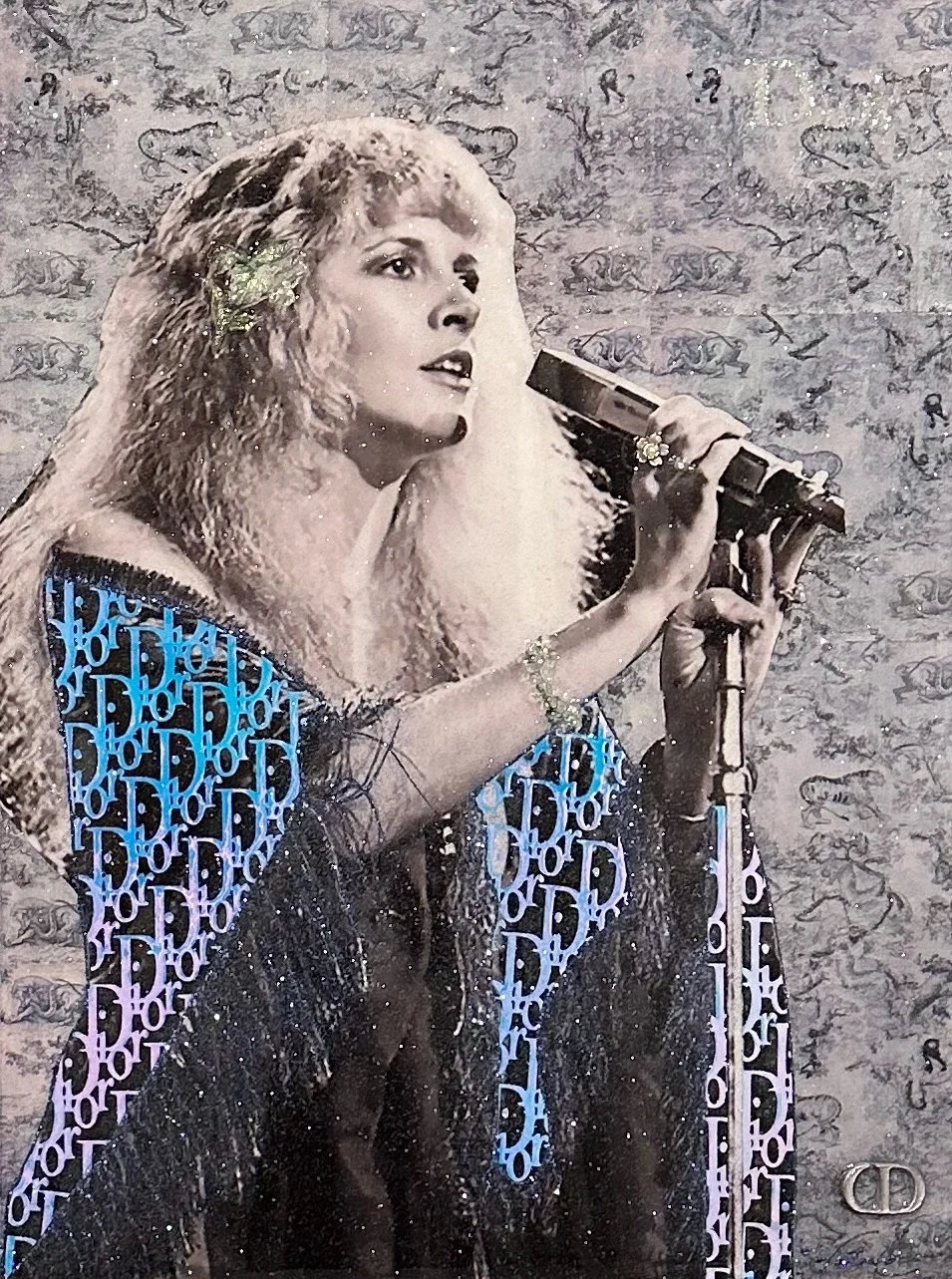 Dior Dreams is a 24 × 18 × 1.5-inch original mixed-media portrait inspired by Stevie Nicks. Hunter Connor layers her iconic image with Dior-inspired details, atmospheric textures and expressive collage to celebrate the Fleetwood Mac vocalist’s ethere