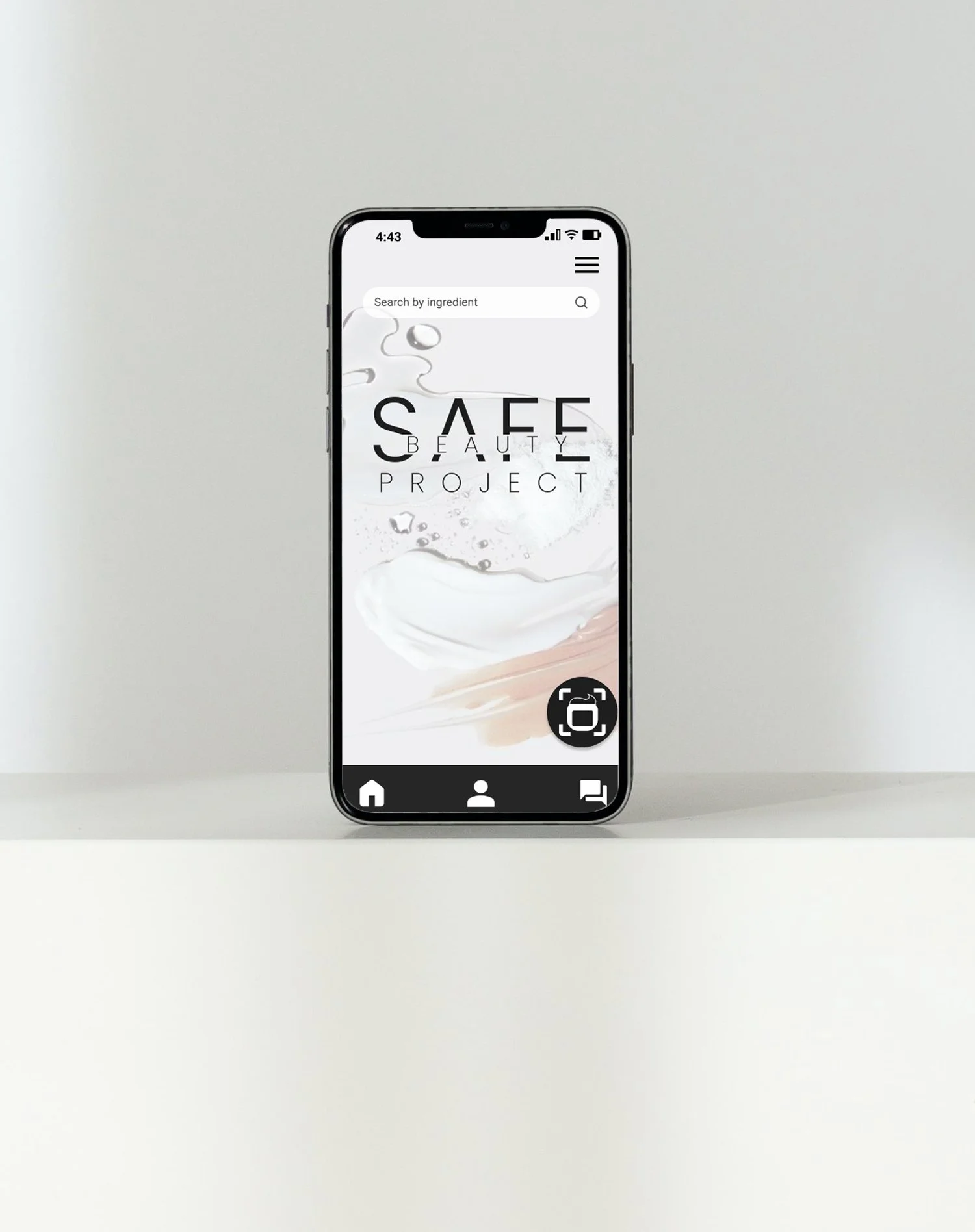 A smartphone displaying an app called 'Safe Beauty Project' with a search bar at the top, a minimalist design featuring skincare or beauty products, and navigation icons at the bottom.