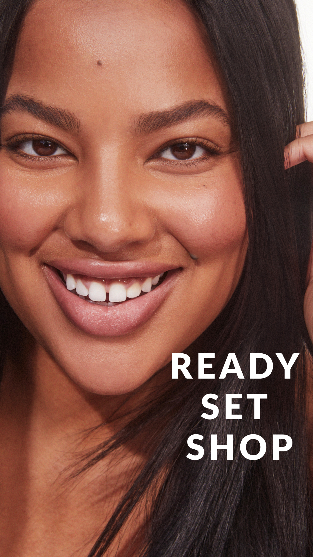 Close-up of a smiling woman with long dark hair and brown eyes, with the text "Ready Set Shop" overlayed on the bottom right.