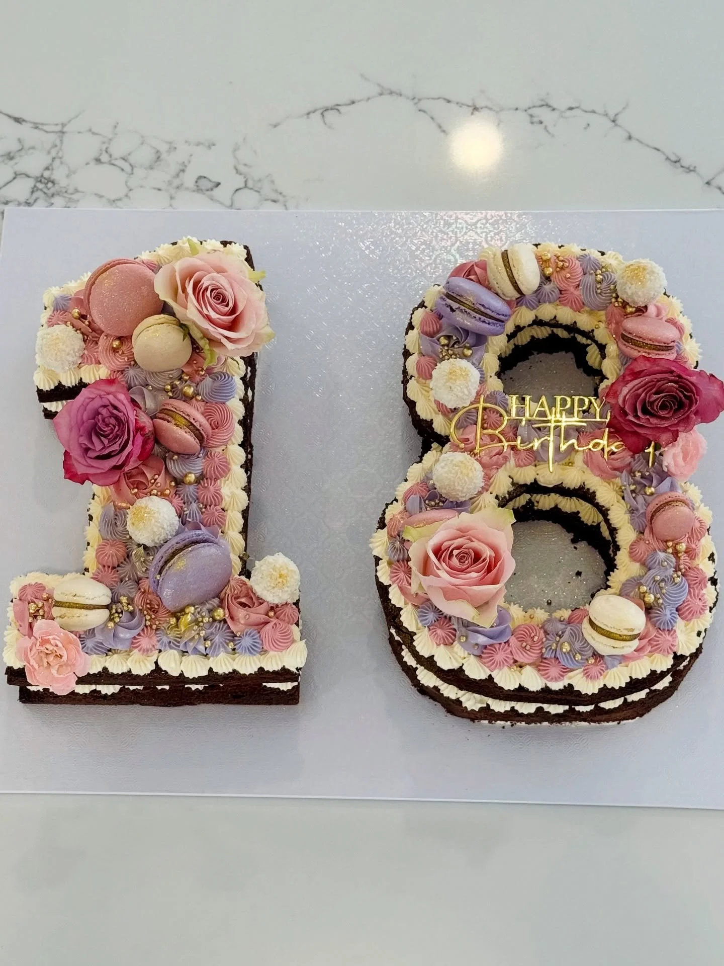 💕 Number 18 cake✨🌸

Topped with macarons, flowers, and pastel buttercream details perfect for celebrating life&rsquo;s sweetest milestones 🌸✨

📍 Brisbane / GoldCoast / Bahrs Scrub | DM to order your custom number cake 🎂✨

#NumberCake #18thBirthd