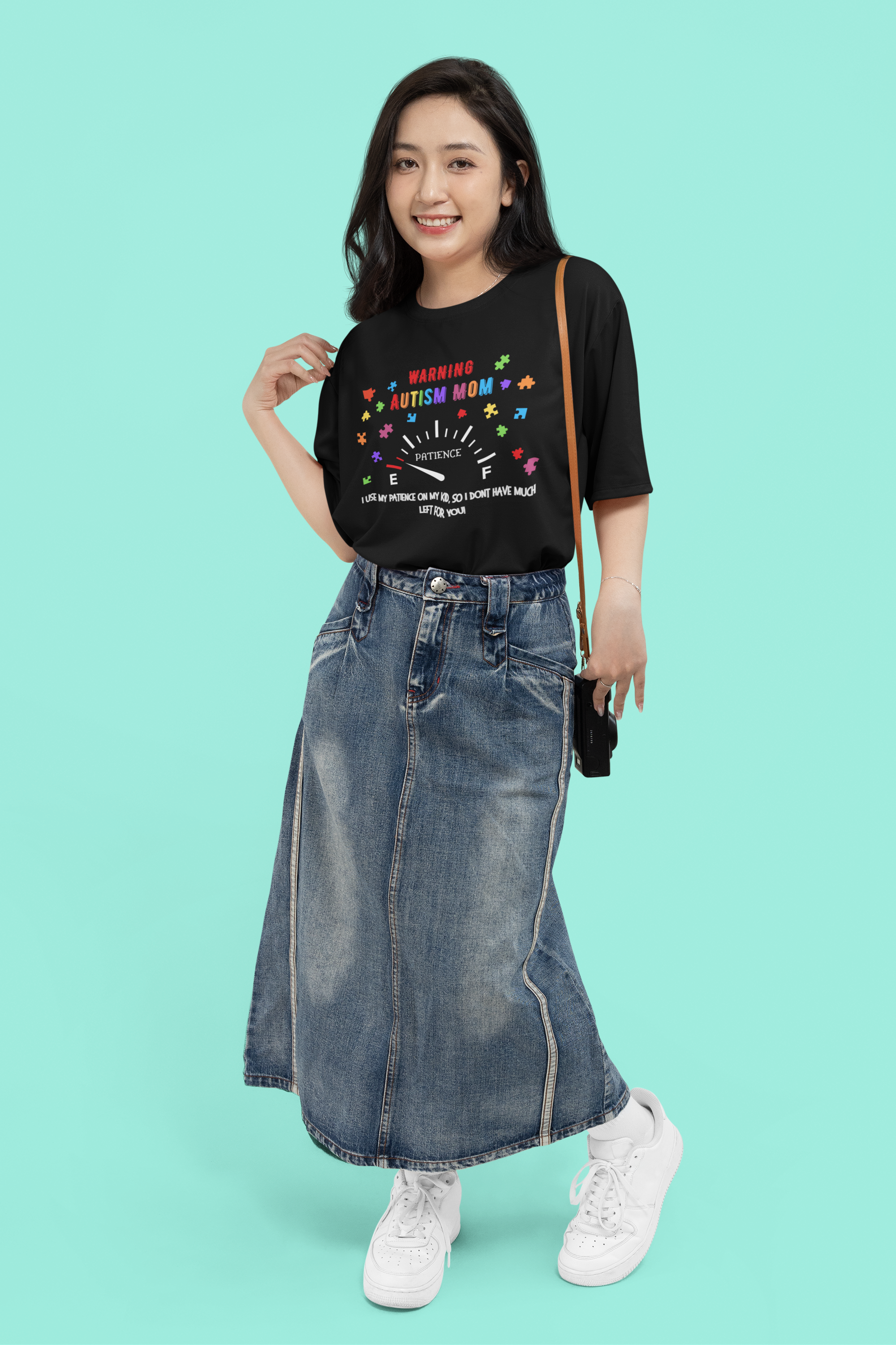 mockup-of-a-smiling-woman-wearing-a-round-neck-tee-and-denim-garments-in-a-studio-m50534.png
