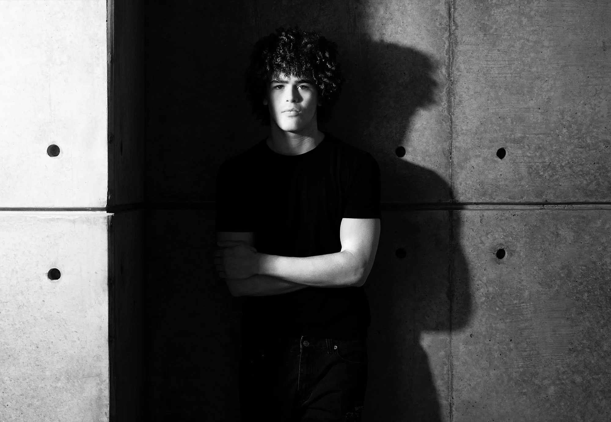 Drayden Lane, black-and-white portrait in dramatic light.
