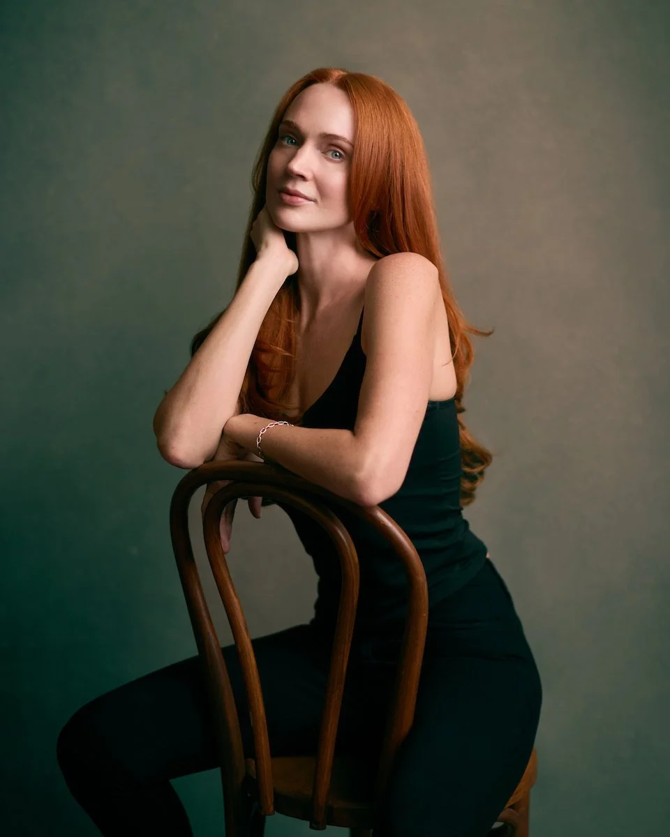 Taylor VanBebber, seated three-quarter studio portrait.
