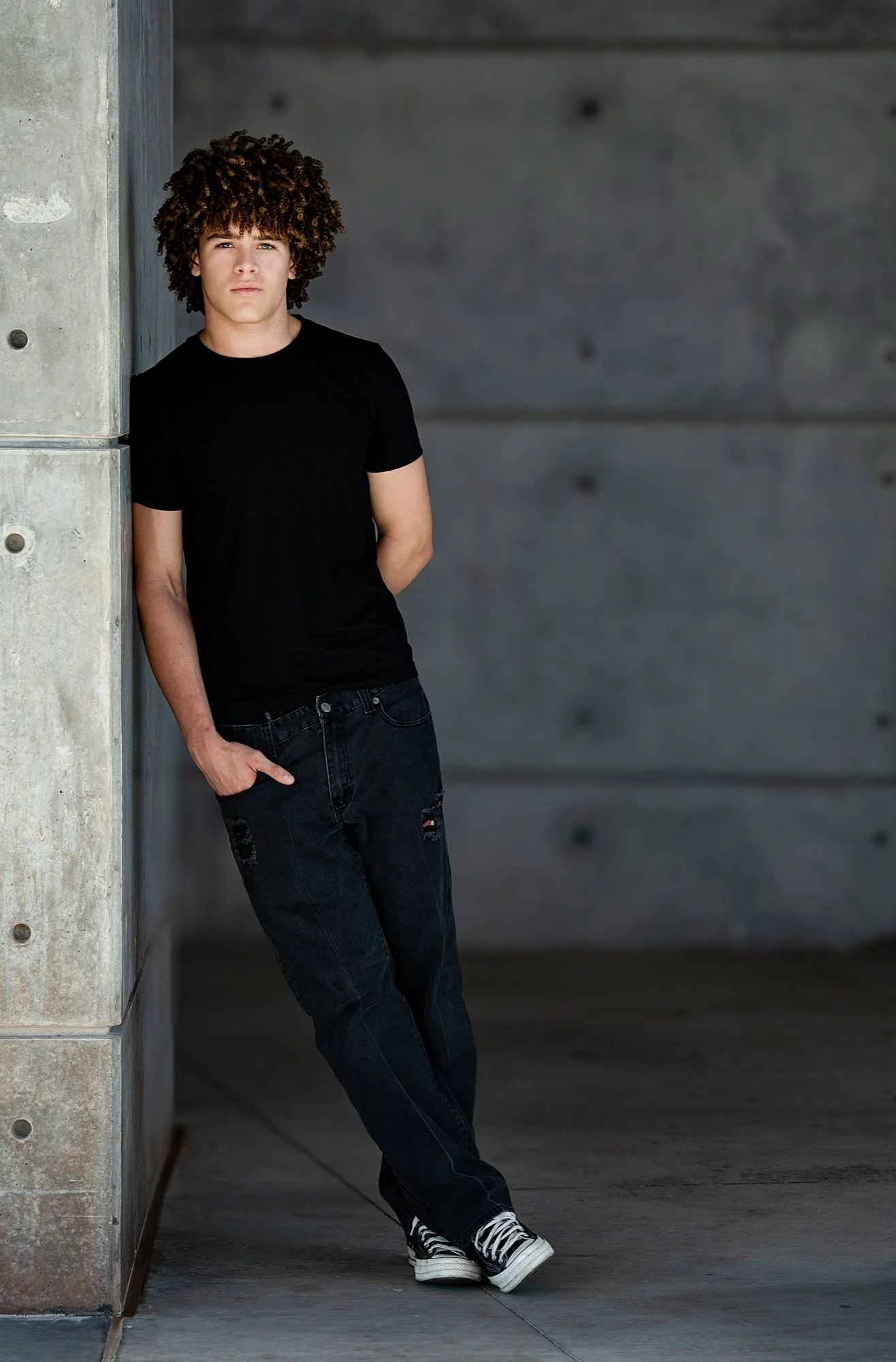Drayden Lane, full-length portrait in a black T-shirt and jeans.