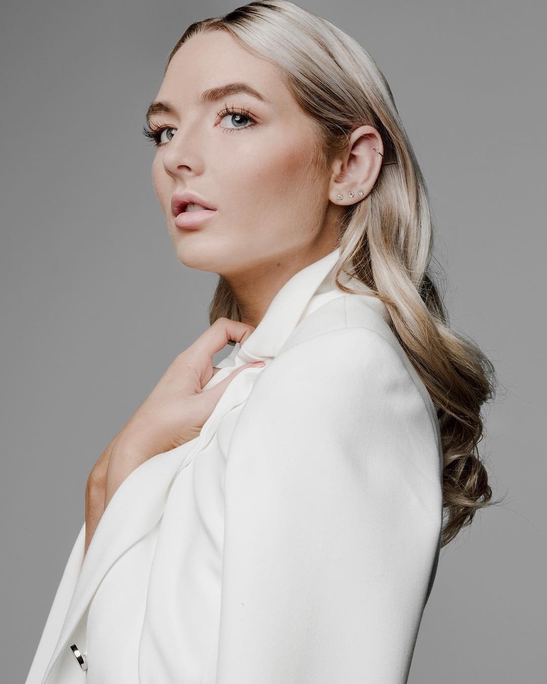Maddie Jordan in a white jacket, photographed by Tony Li.