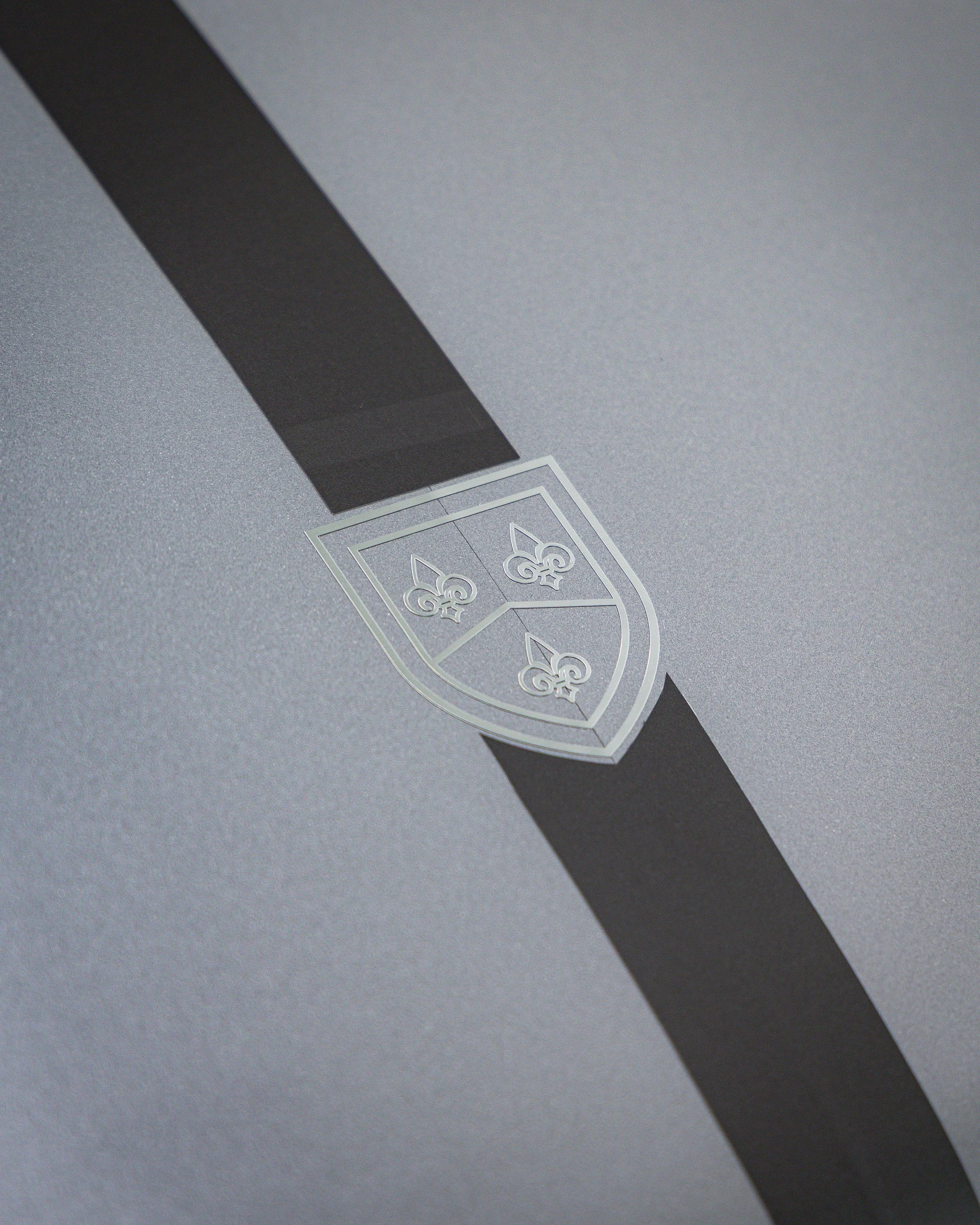 Close-up of a silver RML logo