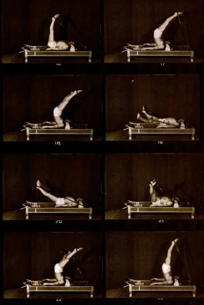 A sequence of six black-and-white images of a person lying on a table, performing a series of physical movements involving raising and lowering their legs and back, using straps for support.