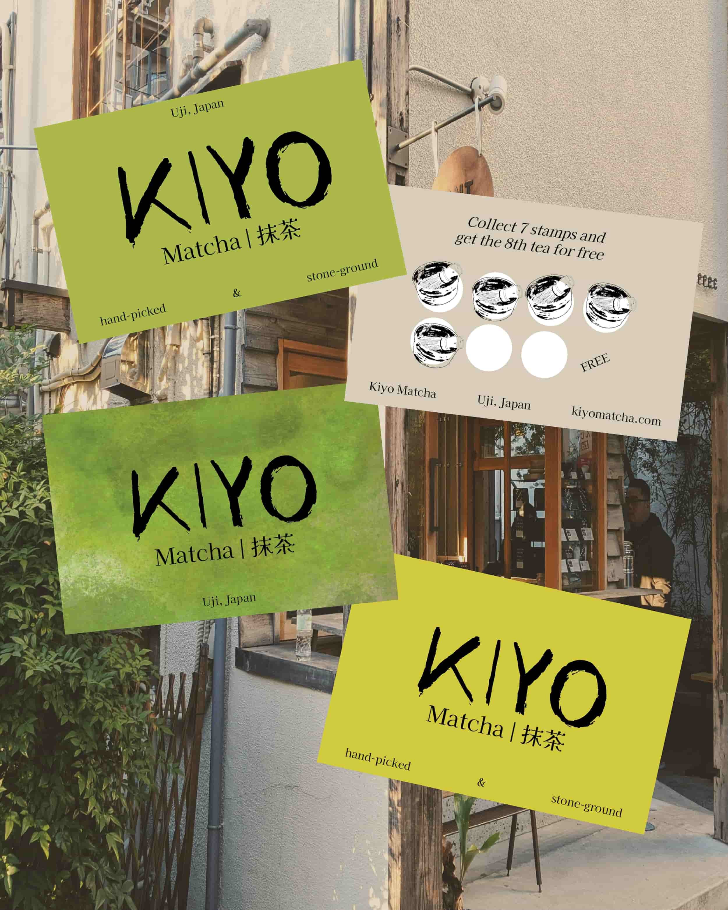 Multiple KIYO Matcha signs advertising hand-picked and stone-ground matcha, located outside a shop in Uji, Japan, with a promotional coupon for free tea.