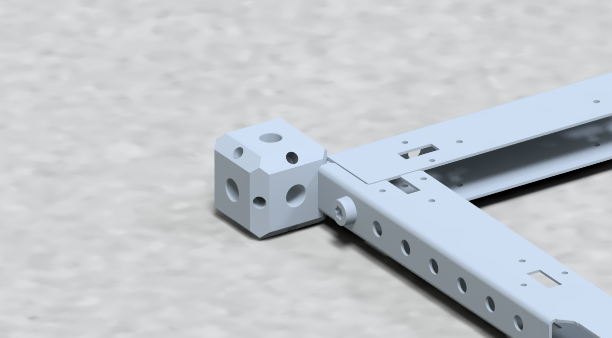 Close-up view of a metallic sliding mechanism with multiple holes, attached to a textured gray surface.