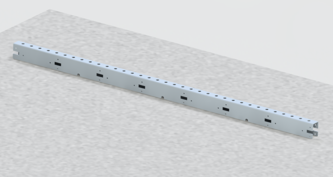 A metal sliding rail or track on a concrete surface.