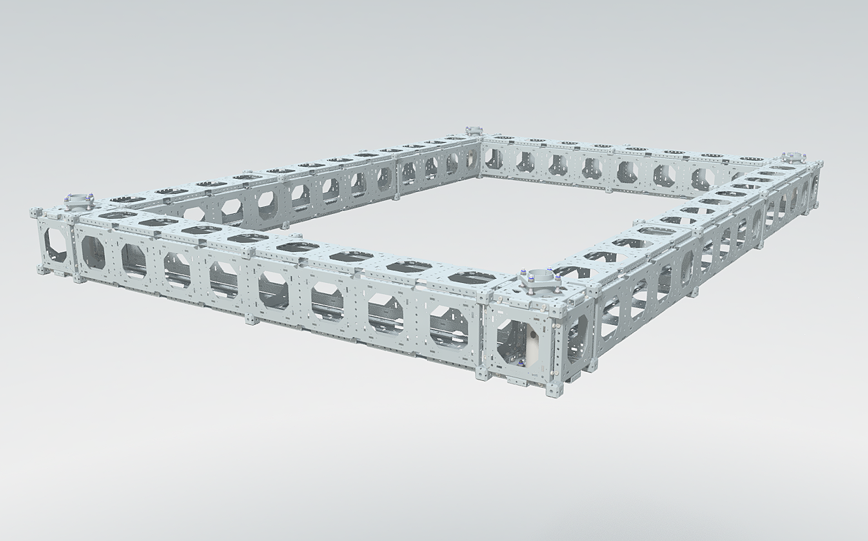 A rectangular metal frame structure with multiple holes and cutouts, resembling a robotic or mechanical assembly component.